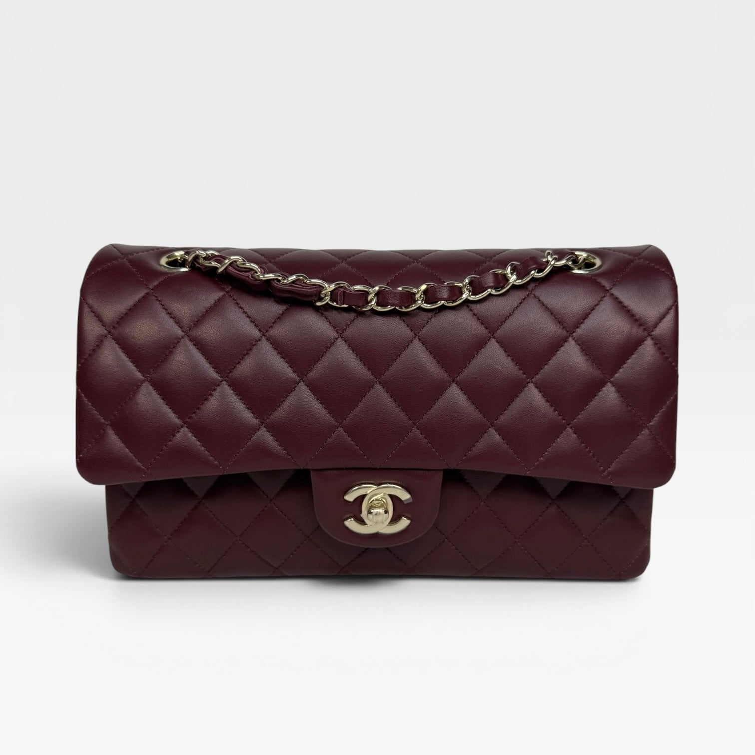 Chanel Medium Classic Double Flap Burgundy Lambskin Leather With Pale Gold Hardware. Authentic and preloved in excellent condition with 100% authenticity guarantee.
