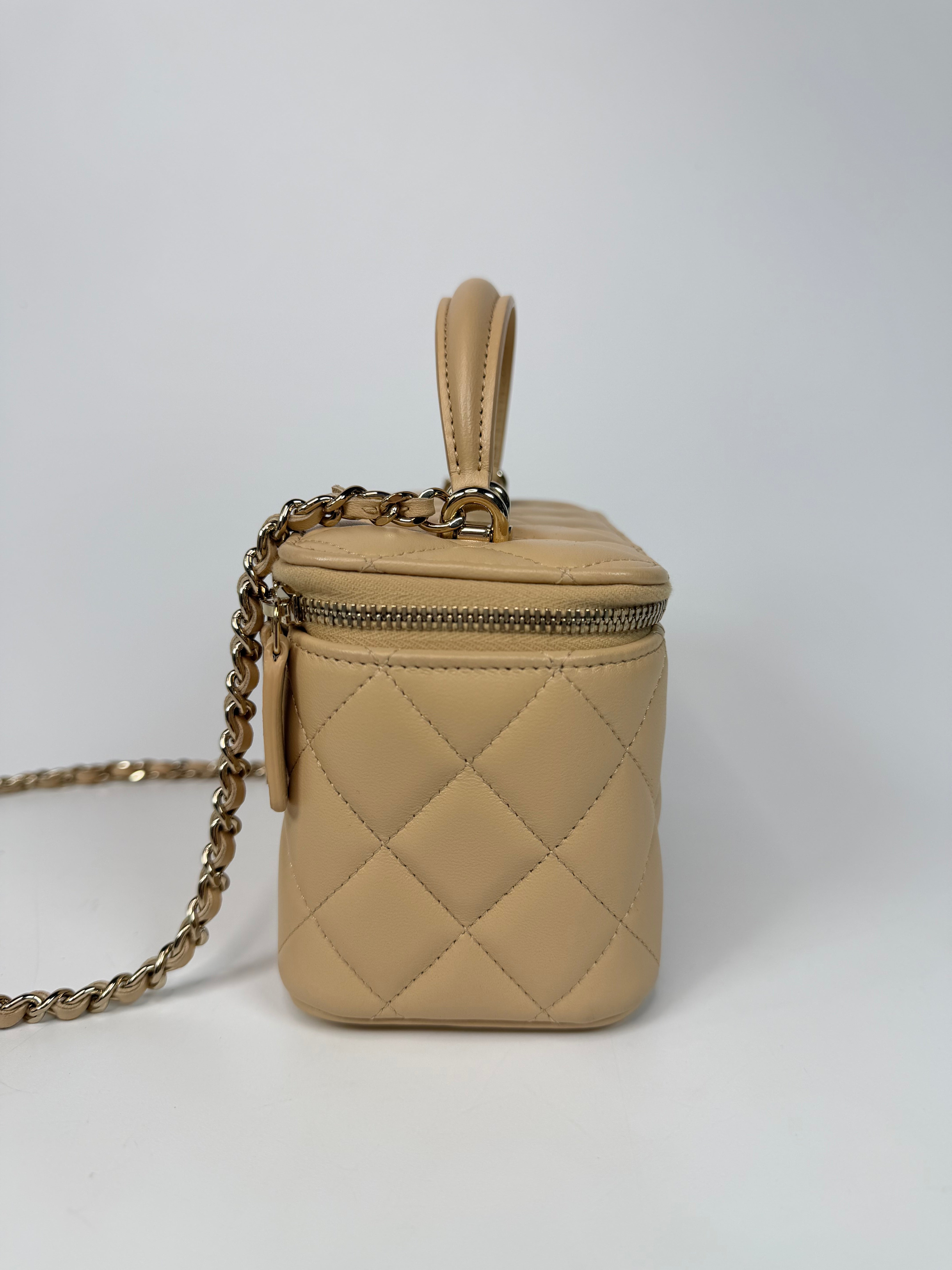 Chanel Mini Vanity Top Handle In Light Beige Lambskin Leather With Gold Hardware. Authentic and preloved in excellent condition. Insured next day delivery. Verified by Luxe Cheshire