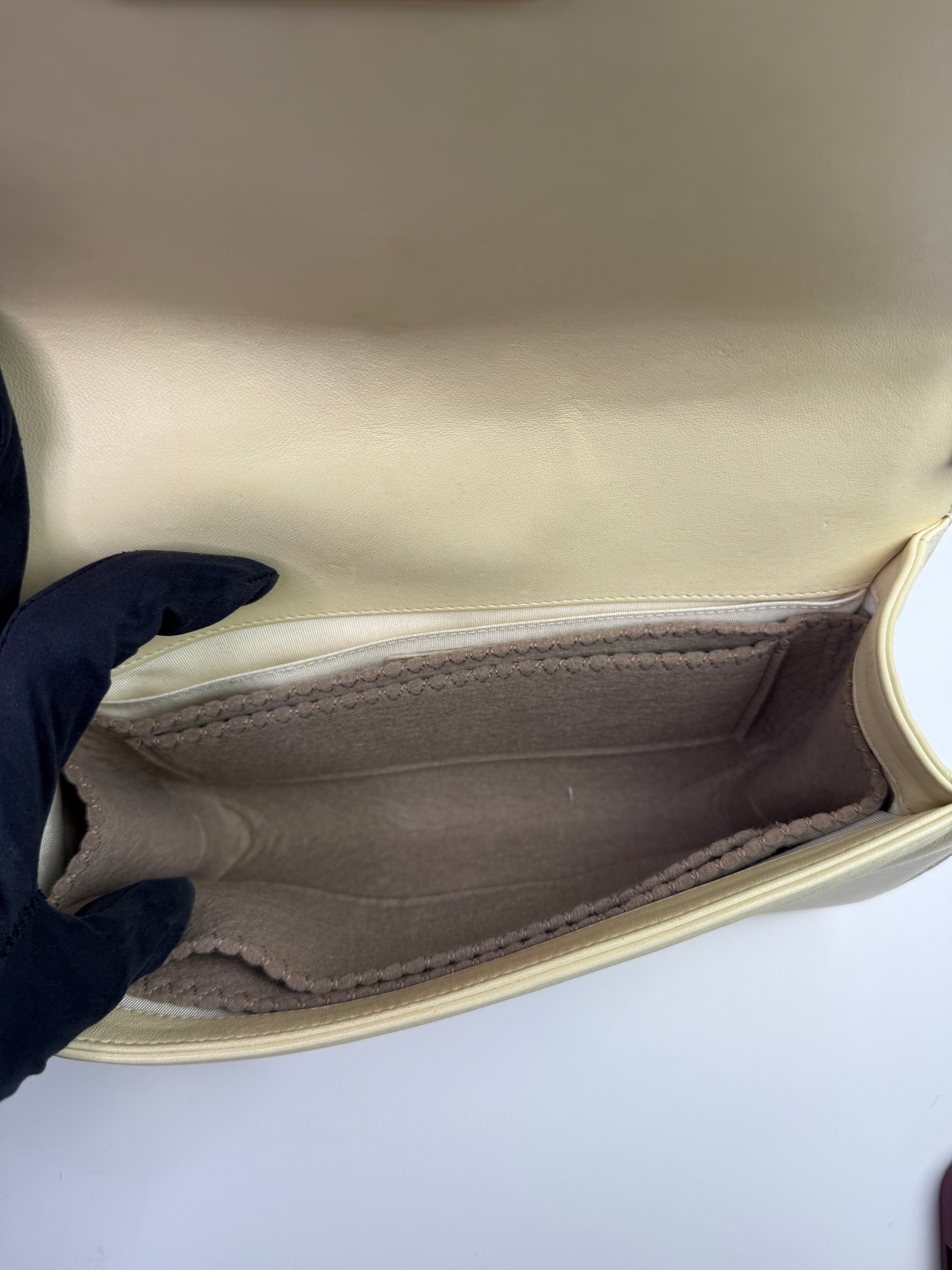 Authentic pre-loved Chanel Boy Bag Medium In Cream Lambskin With Gold Hardware.