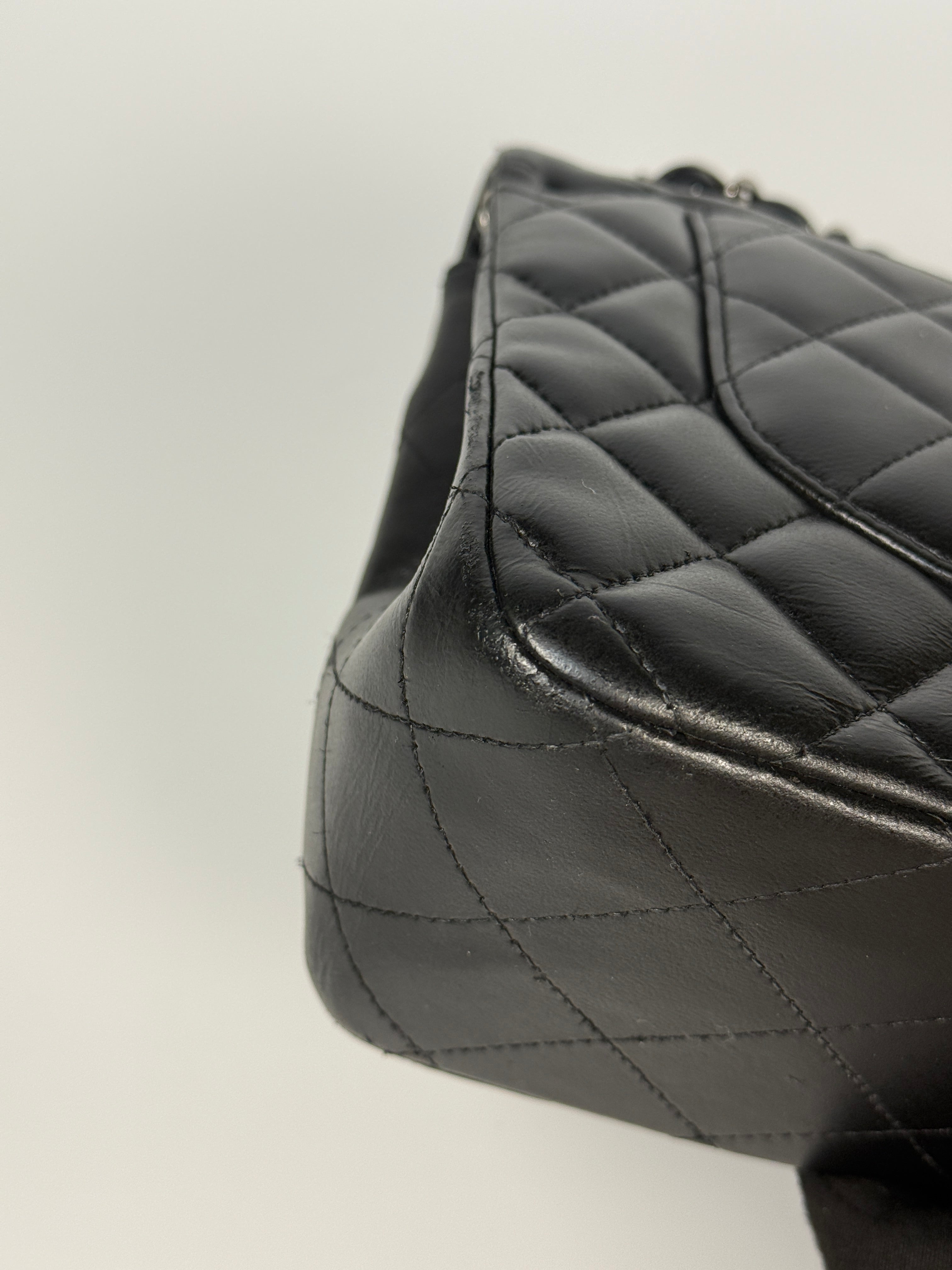 Authentic and preloved Chanel Jumbo Classic Flap Bag In Black Lambskin Leather With Silver hardware. Very Good condition. 100% Authenticity guarantee