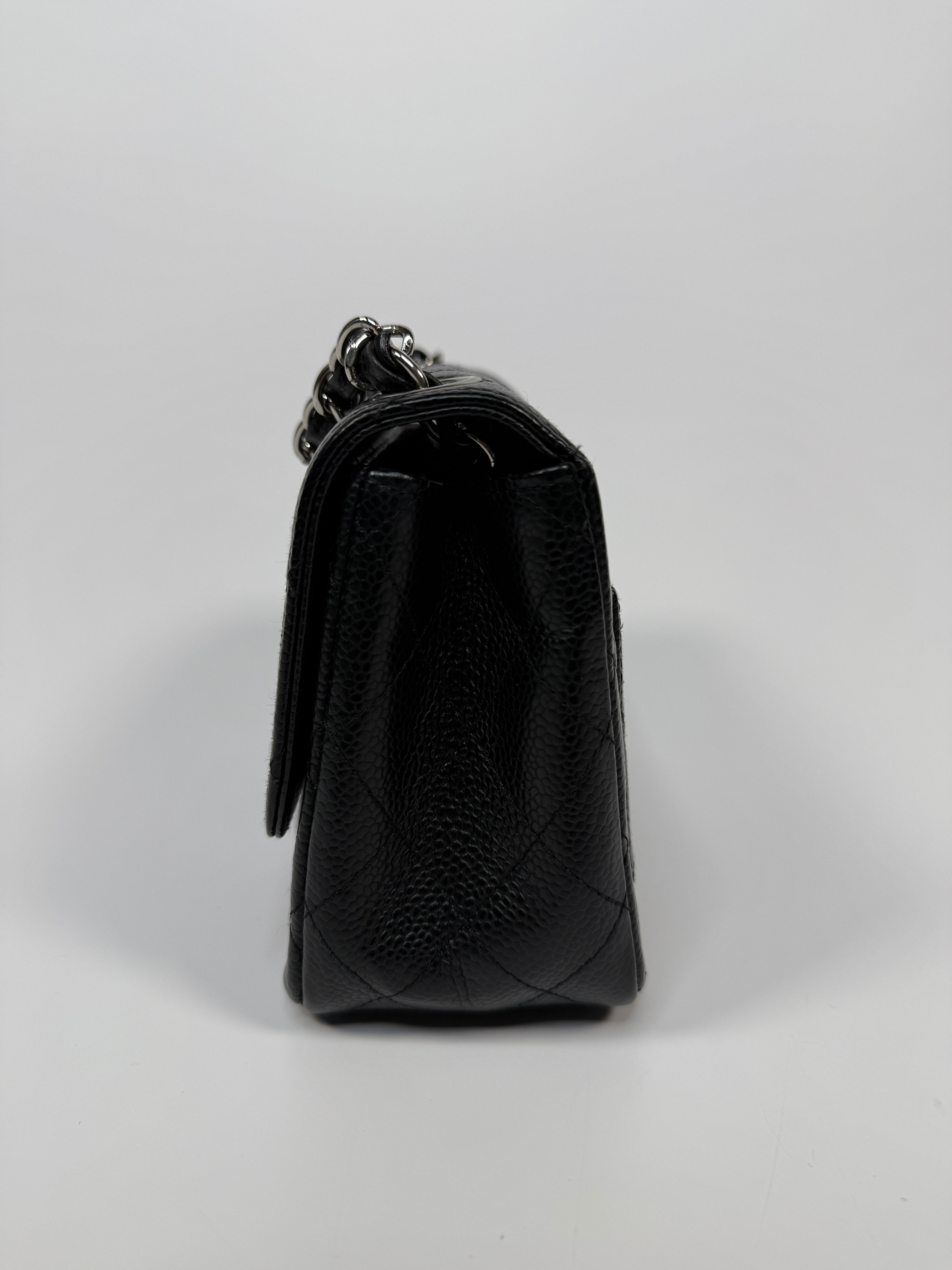 Chanel Black Square Flap Bag In Black Caviar Leather With Silver Hardware. Excellent condition. Authentic and preloved.