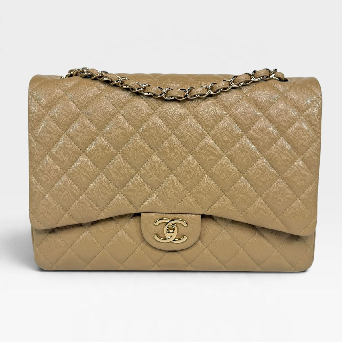 Chanel Maxi Flap In Beige Caviar Leather With Gold Hardware. 100% authentic and pre loved in excellent condition.
