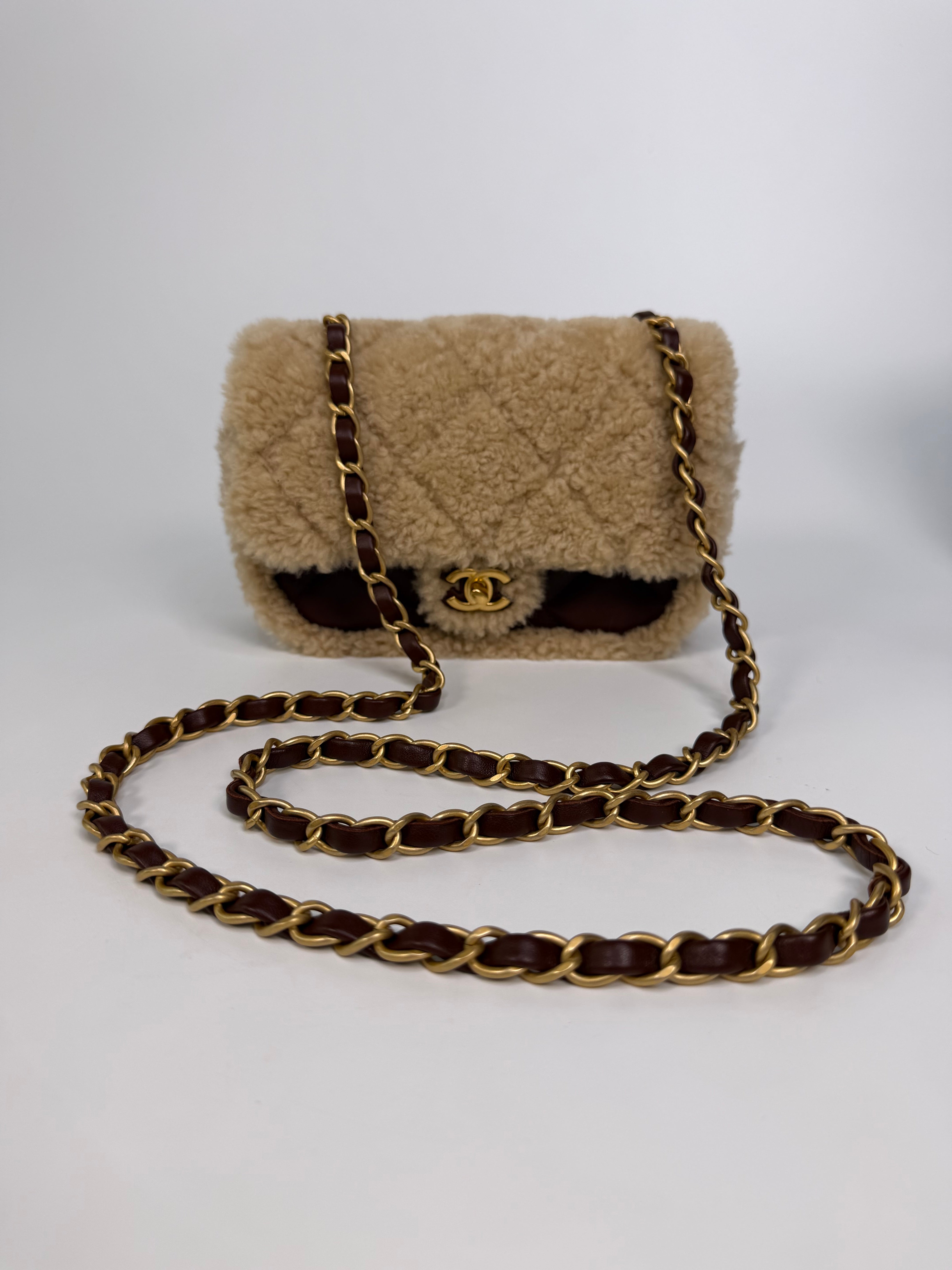 Chanel Mini Rectangle In Brown Lambskin Leather & Shearling With Gold Hardware. Authentic and preloved in excellent condition with 100% authenticity guarantee.