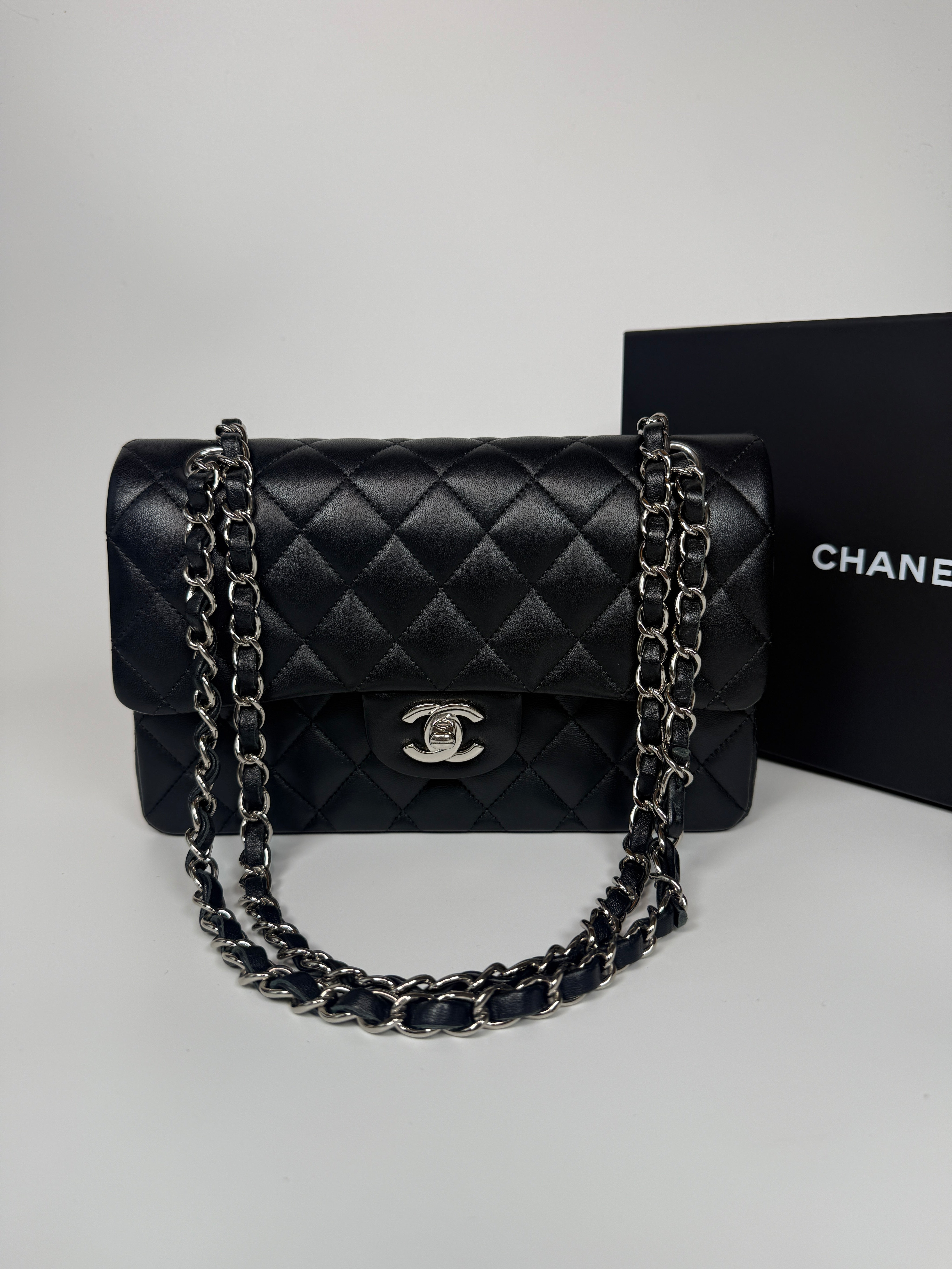 Authentic and preloved Chanel Small Classic Double Flap In Black Lambskin Leather With Silver hardware 100% Authenticity guarantee