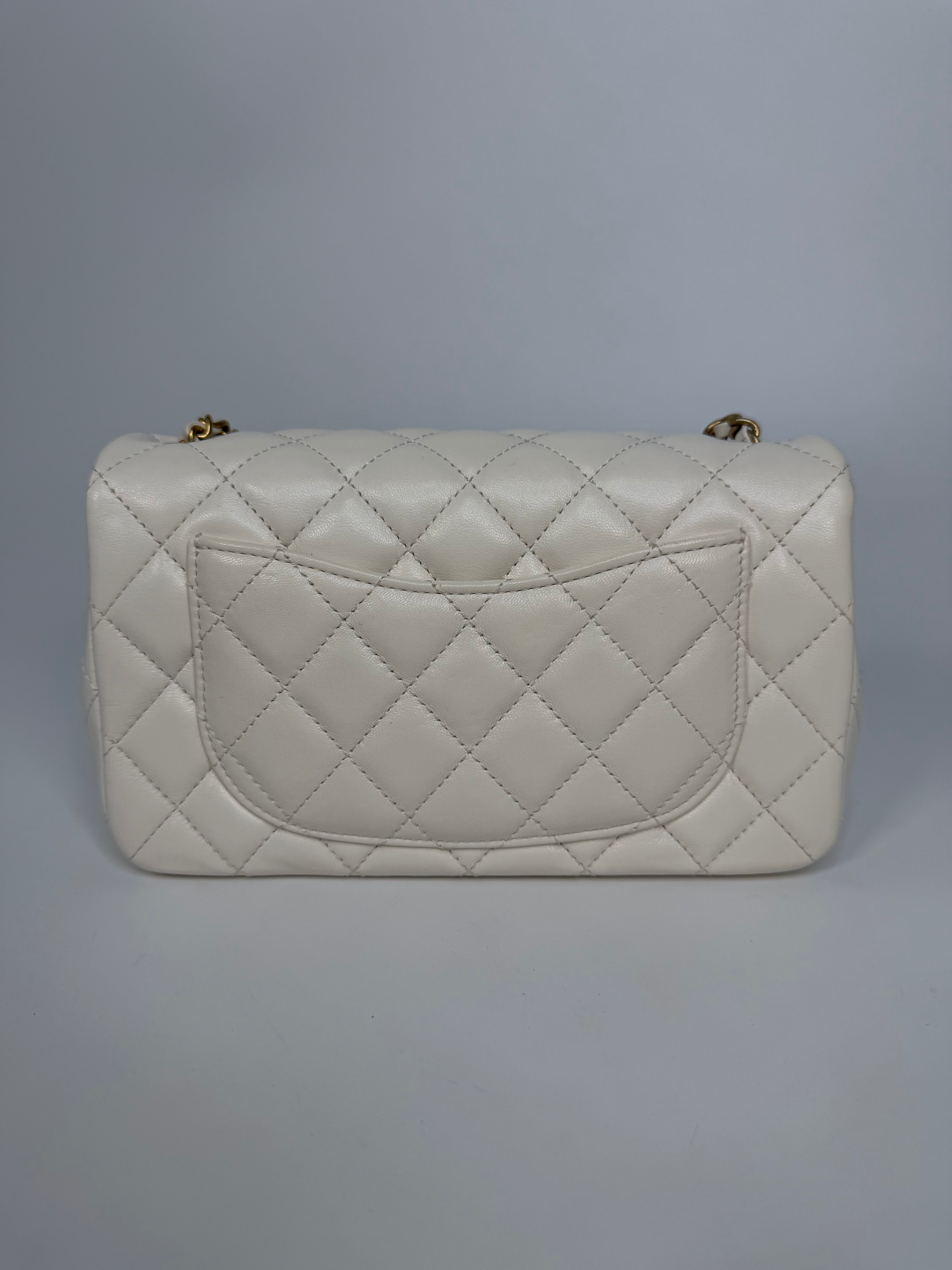 Chanel Pearl Crush Mini Rectangle In White Lambskin Leather Gold Hardware. Authentic and preloved in excellent condition with 100% authenticity guarantee.