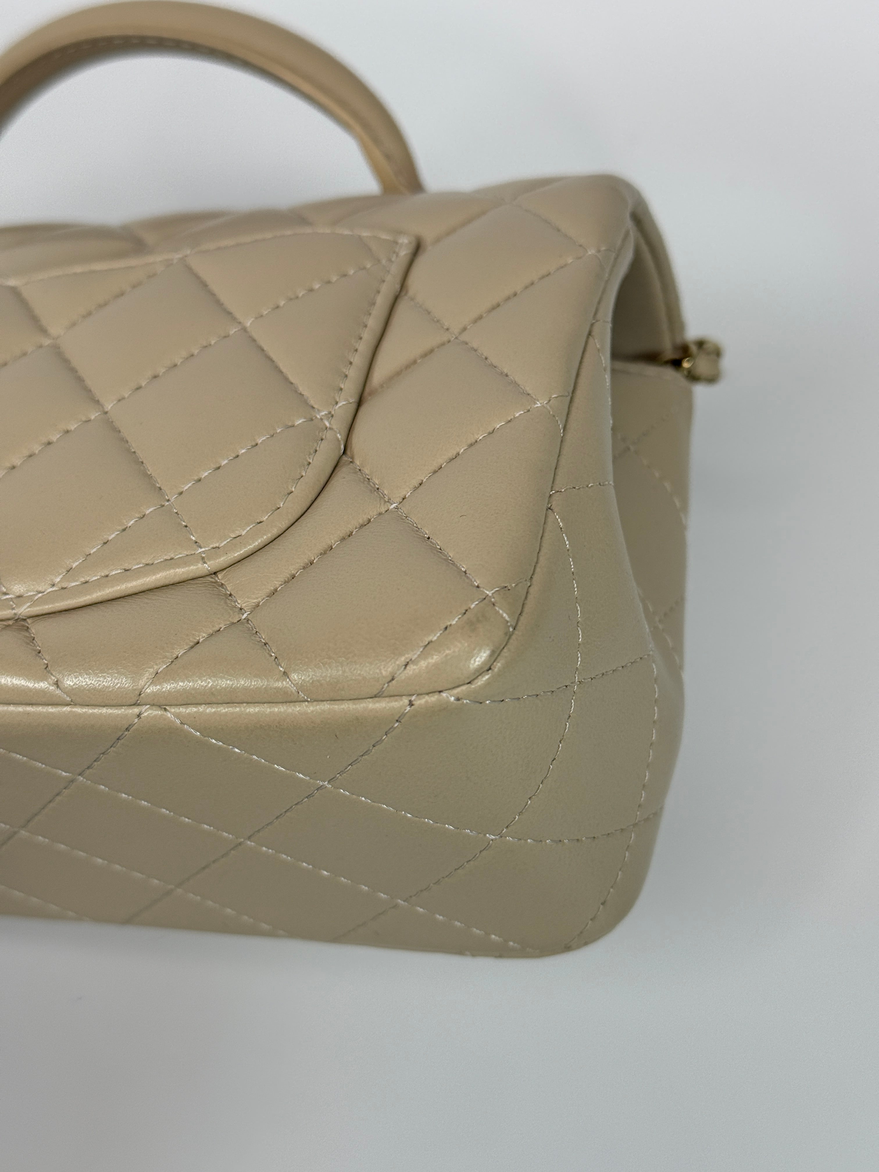 Authentic and preloved Chanel Mini Rectangle Top Handle In Ecru Lambskin With Gold Hardware in excellent condition, Fully insured next day delivery. Verified by Luxe Cheshire. 100% Authenticity guarantee,
