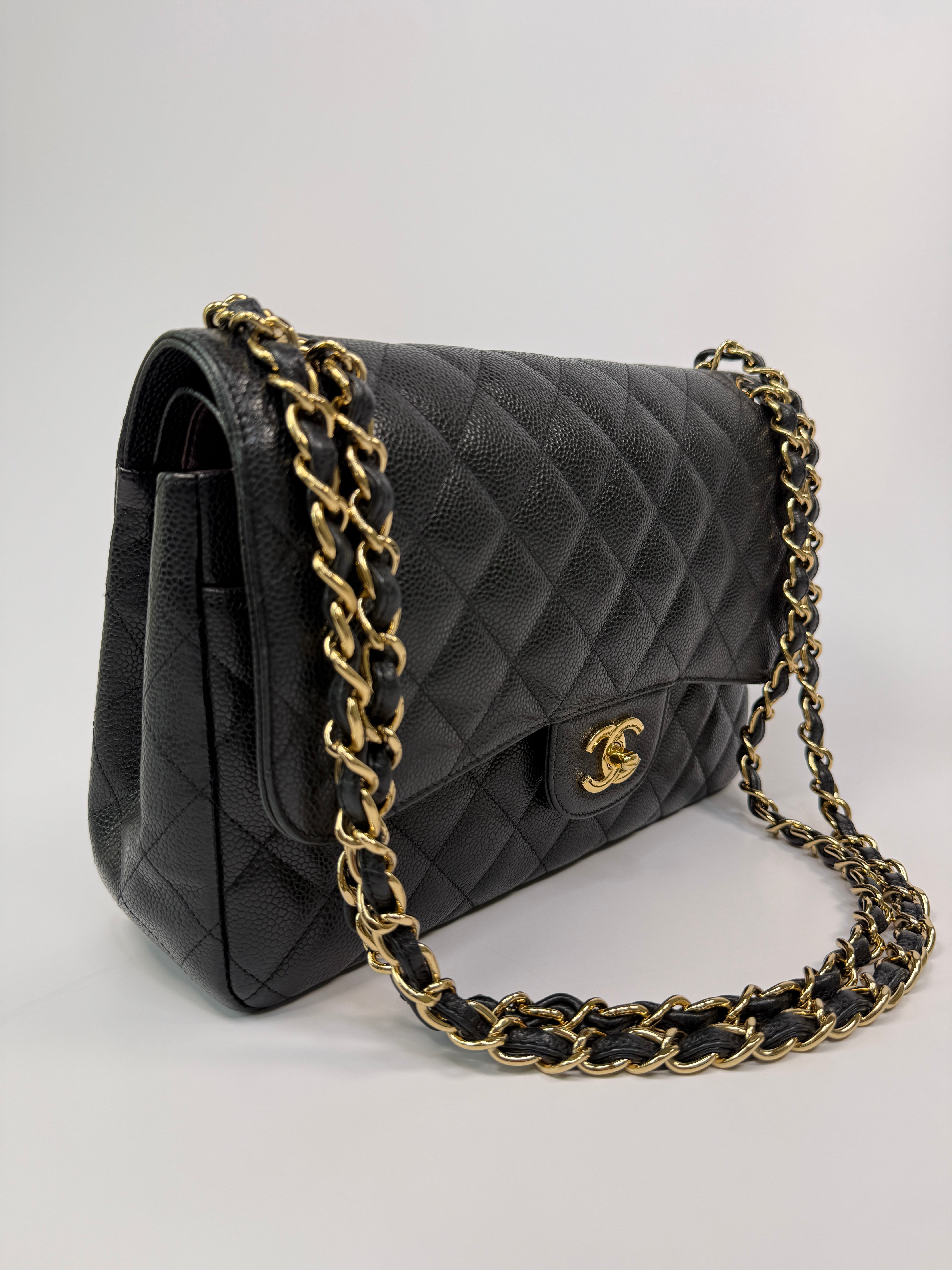 Chanel Classic Jumbo Flap Bag In Black Caviar LeatherWith Gold Hardware
Pre Loved & Authentic