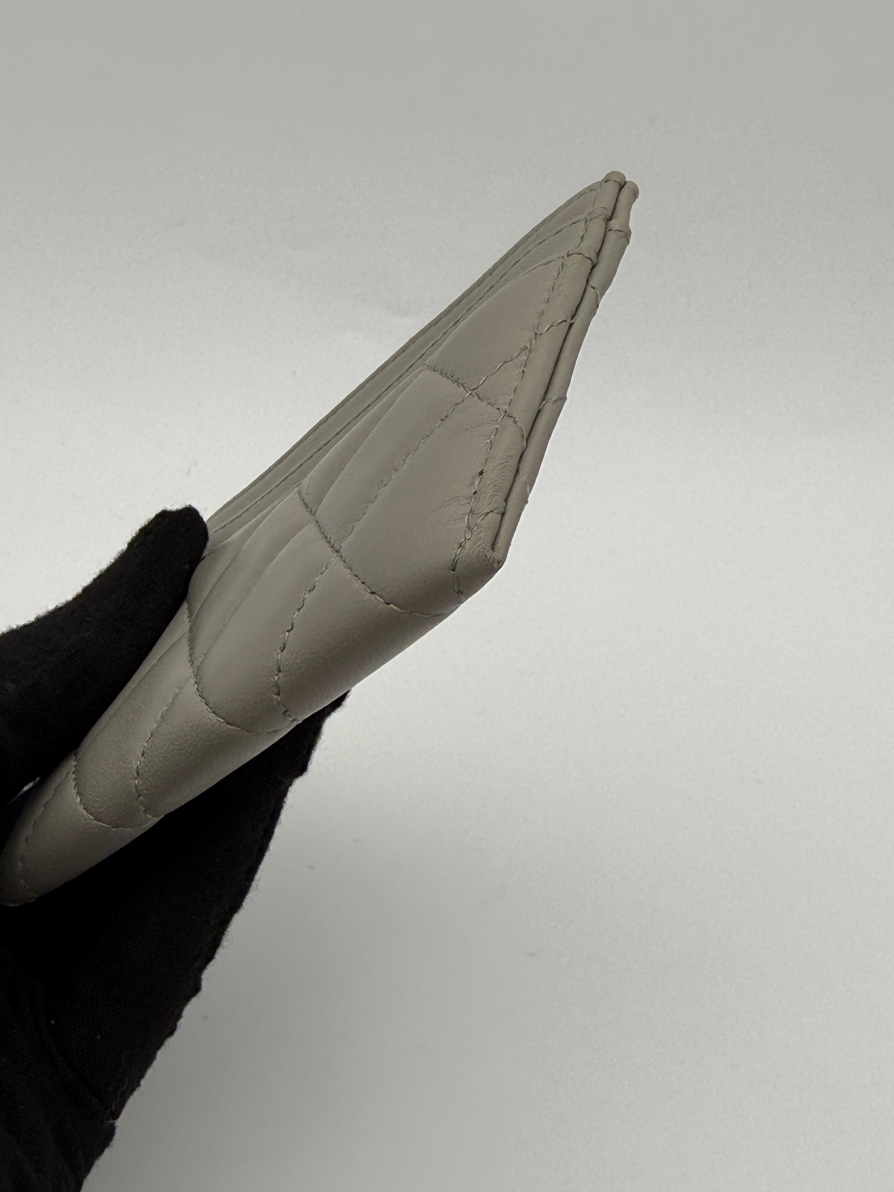 Authentic and pre loved Chanel Classic Card Holder In Grey Lambskin Leather With Silver hardware. Excellent Condition. 100% Authenticity guarantee.