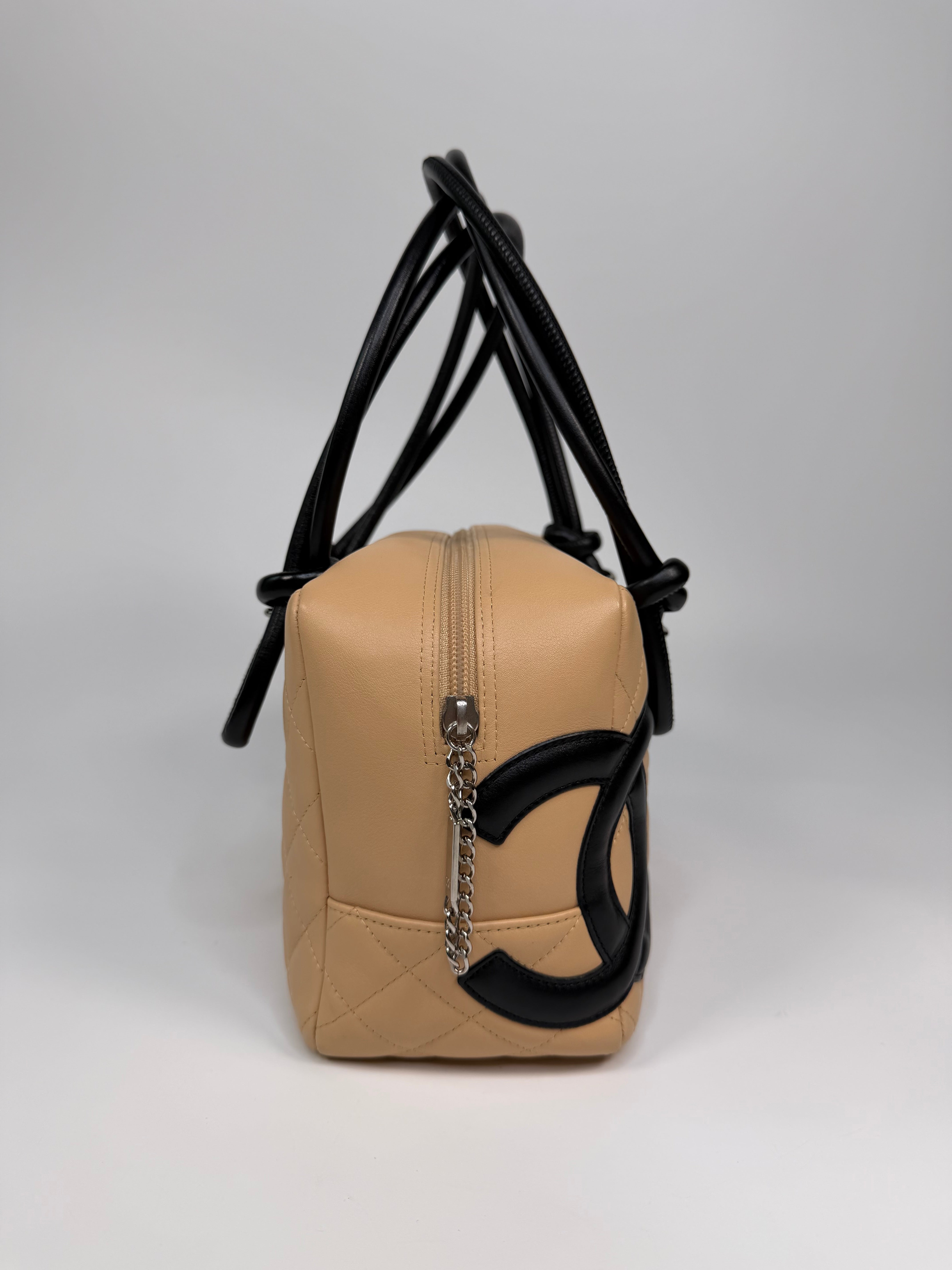 Chanel Cambon Bowling Bag In Beige / Black Leather With Silver Hardware. Authentic and preloved in excellent condition.
