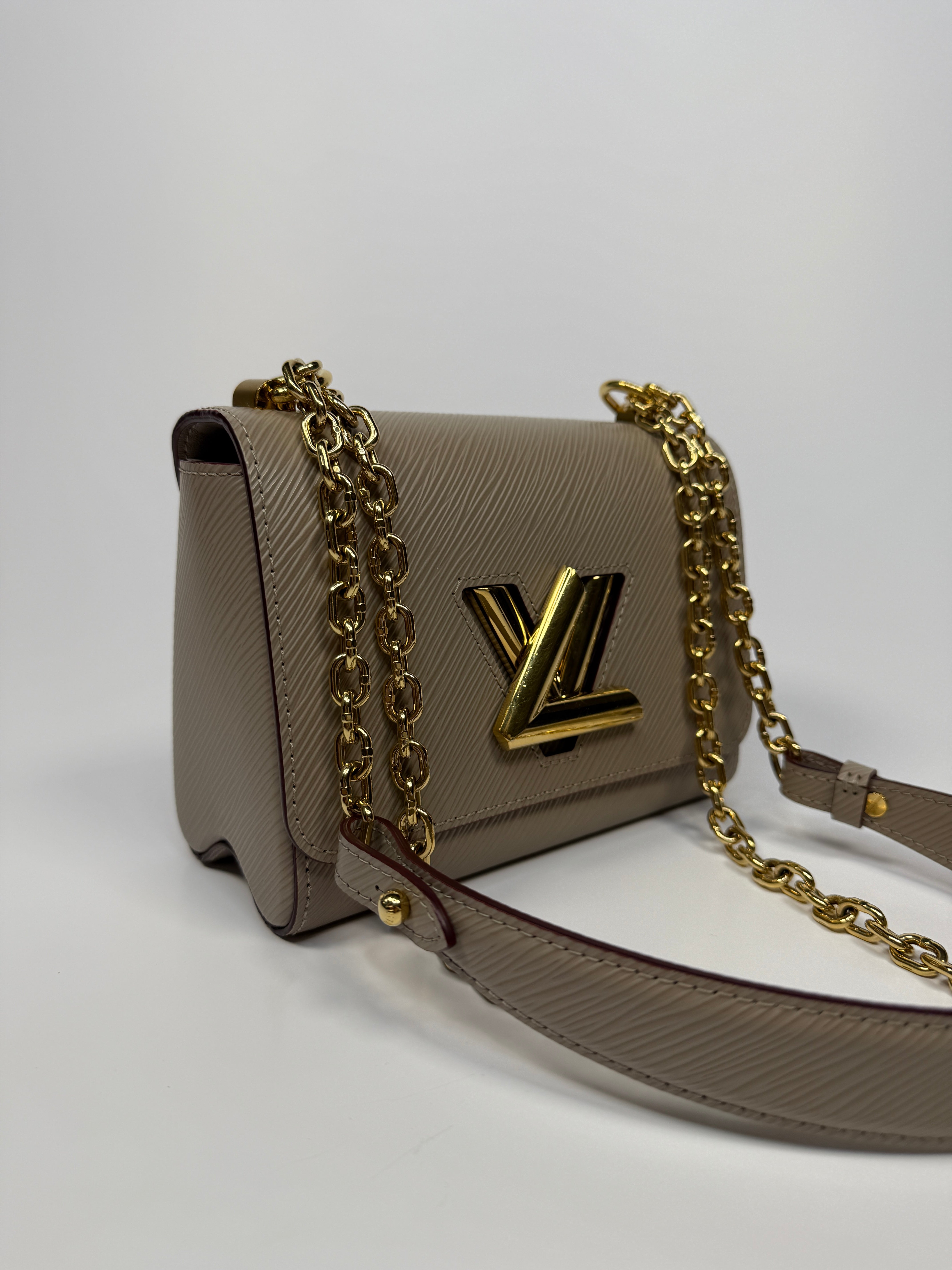 Louis Vuitton Twist PM Shoulder Bag In Beige leather with gold hardware. Authentic and pre loved excellent condition