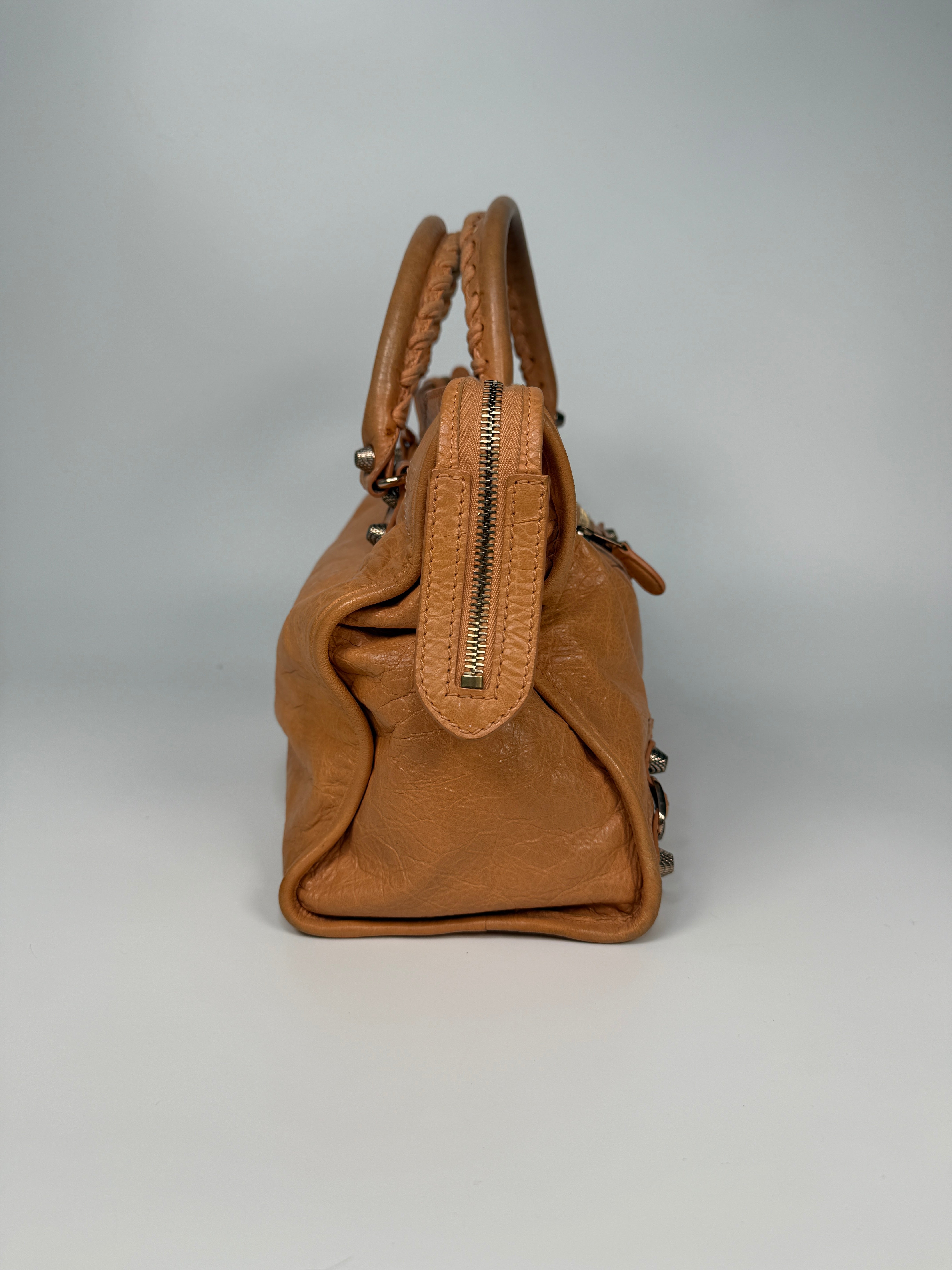 Authentic and preloved Balenciaga Medium Le City Bag In Peach Leather with silver hardware. Very good condition. 100% Authenticity guarantee.