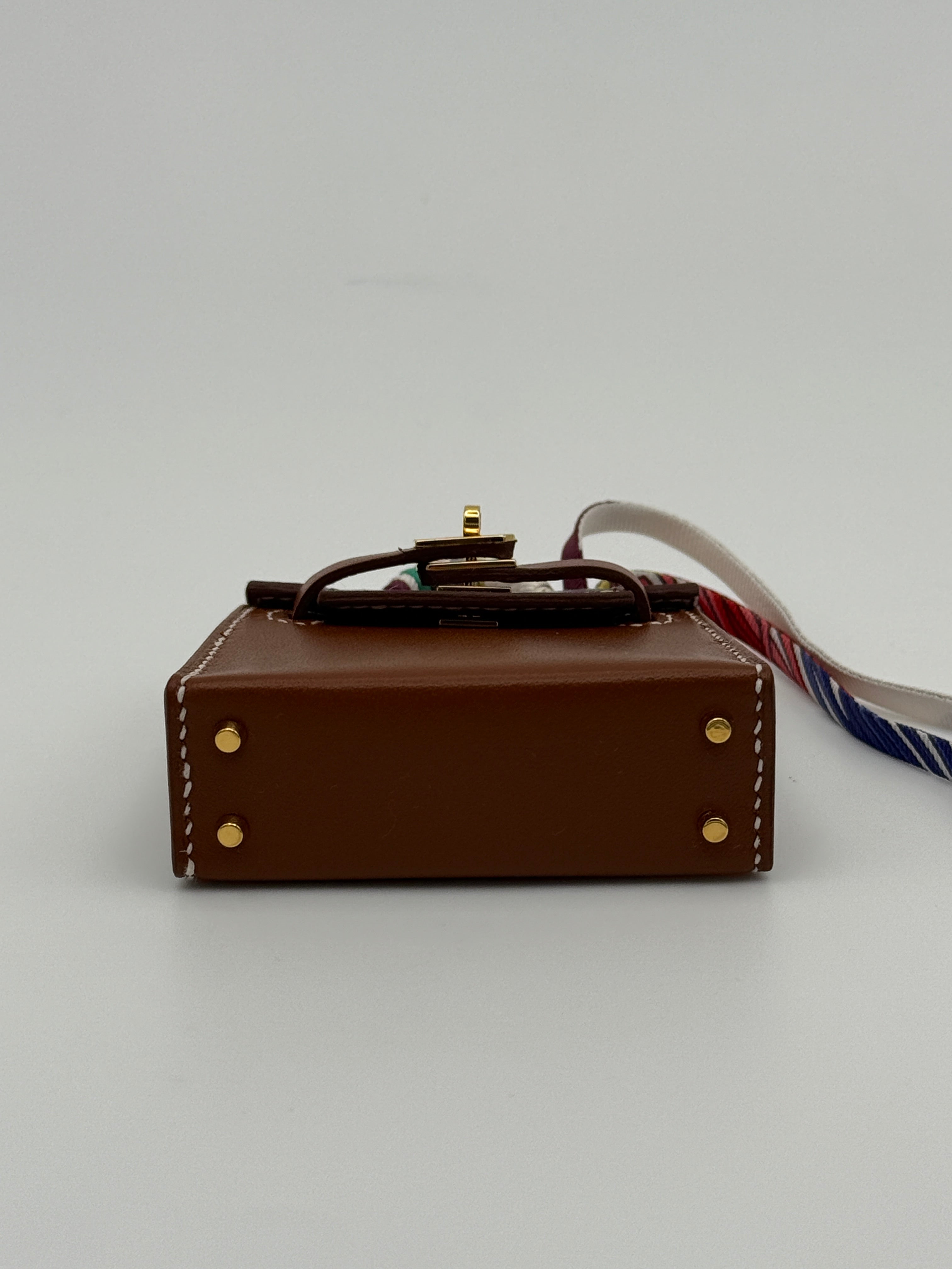 Hermès Kelly Twilly Charm In Gold Tadelakt Leather With GHW