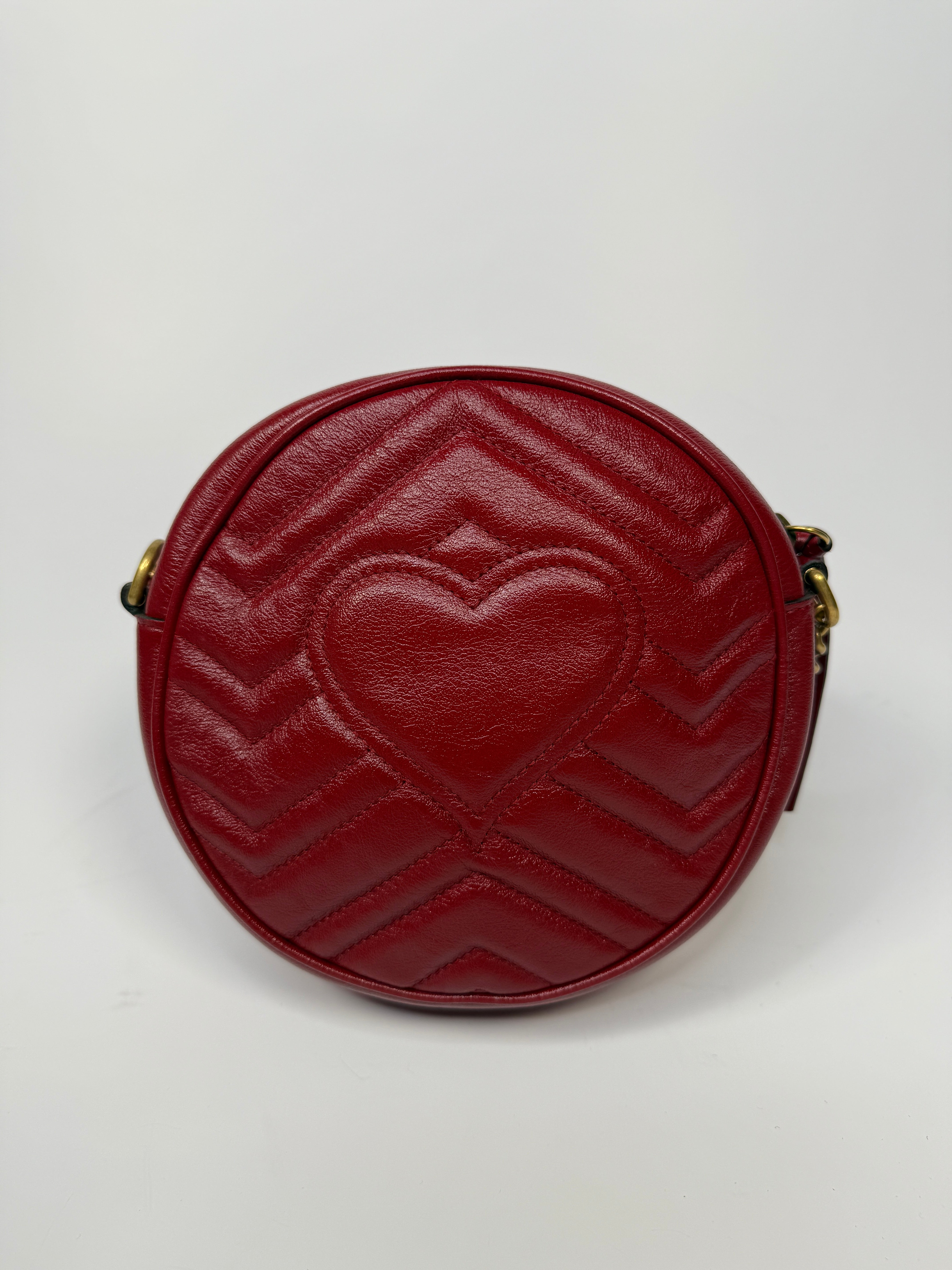 Gucci GG Marmont Round Shoulder Bag In Red Leather, very good condition. Authentic and preloved. 100% Authenticity guarantee