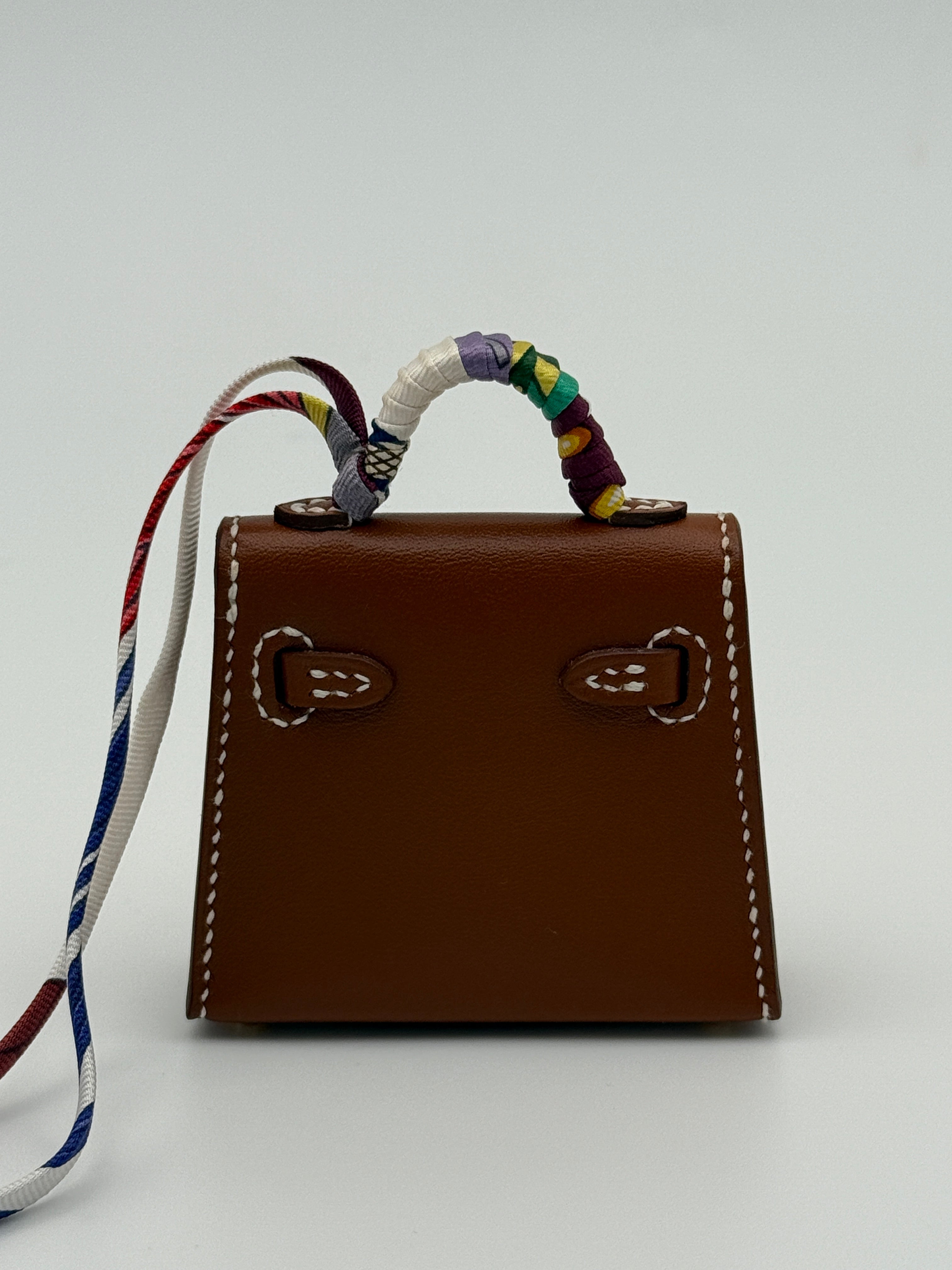 Hermès Kelly Twilly Charm In Gold Tadelakt Leather With GHW