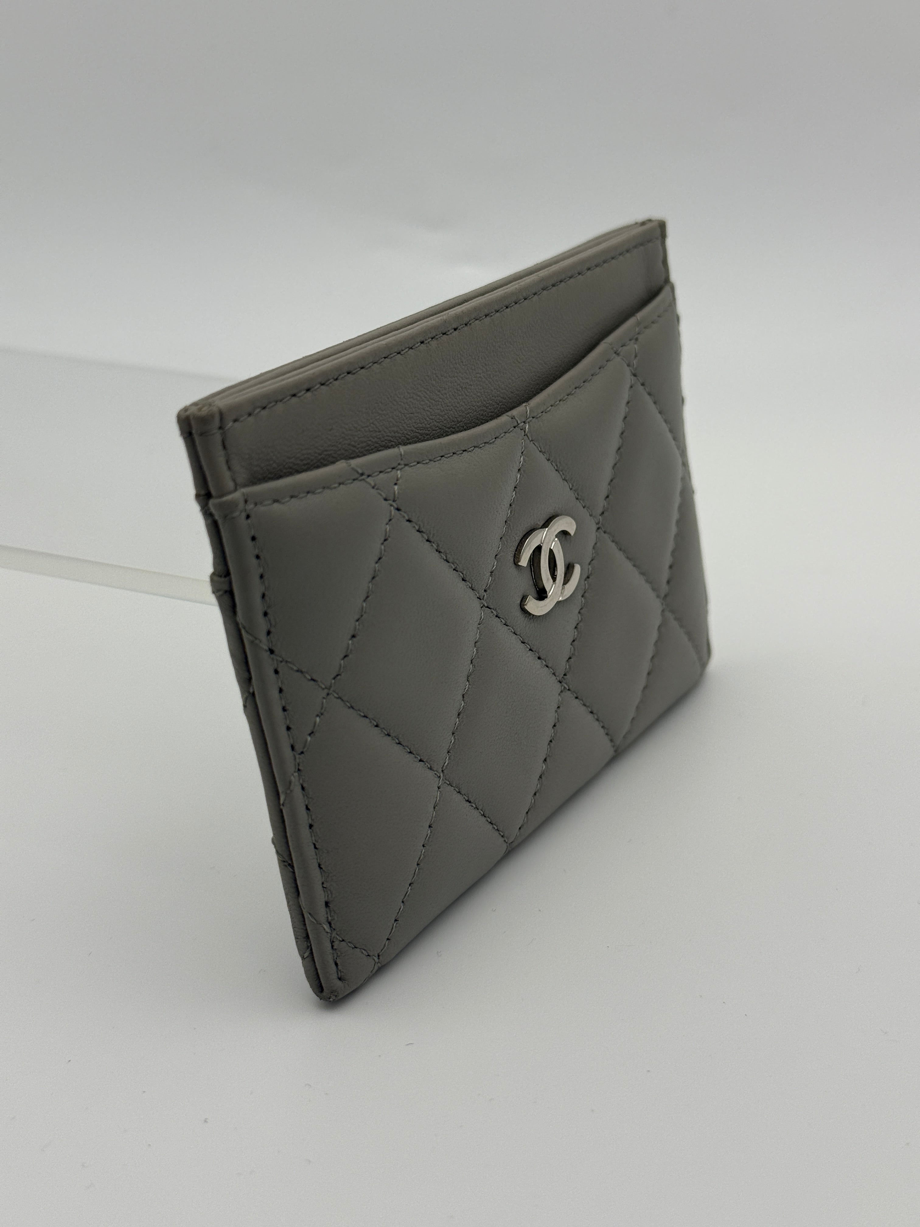 Authentic and pre loved Chanel Classic Card Holder In Grey Lambskin Leather With Silver hardware. Excellent Condition. 100% Authenticity guarantee.