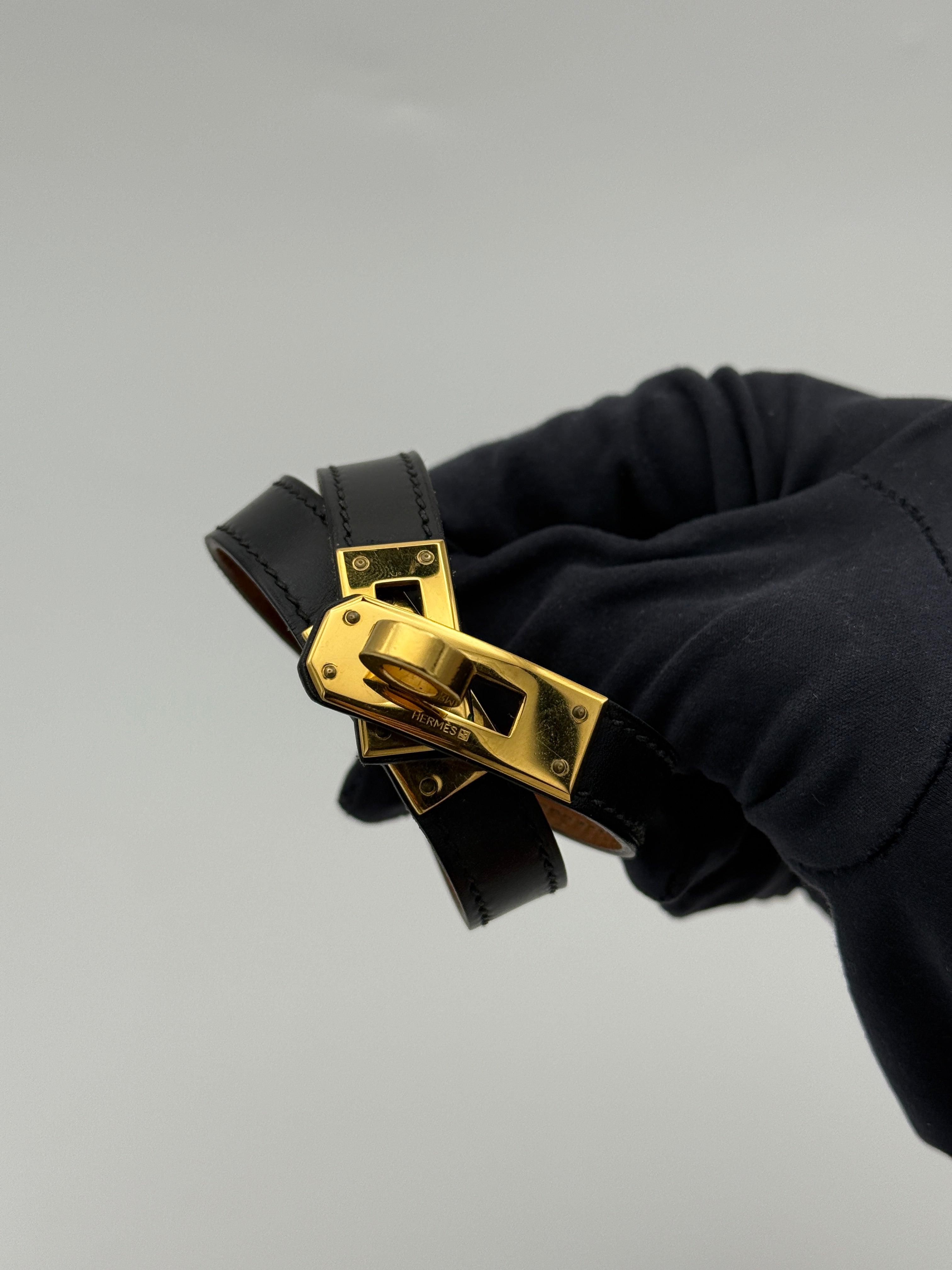 Hermès Kelly Double Tour Bracelet in black leather with gold hardware