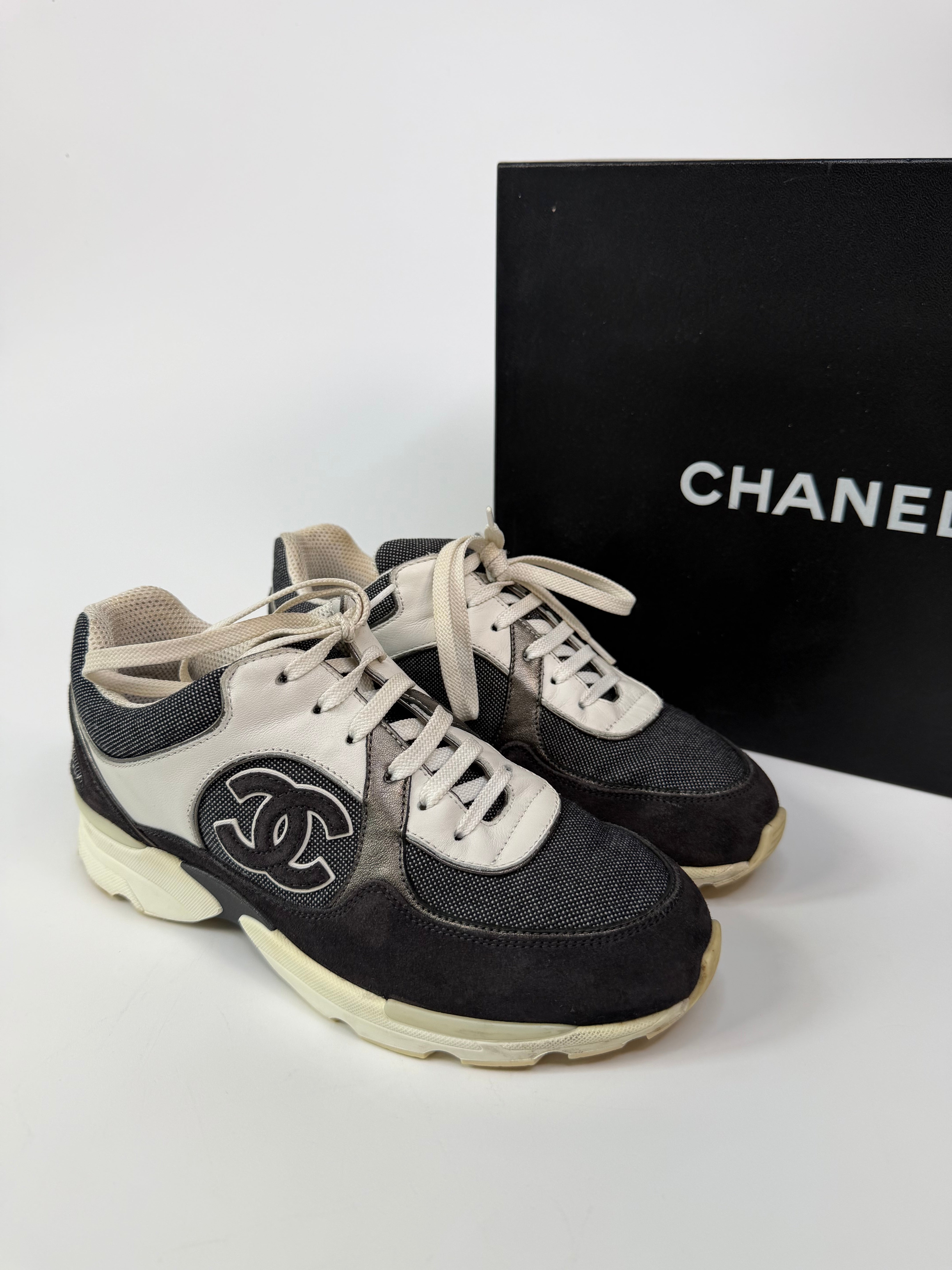 Chanel CC Sneakers In Dark Grey, White & Silver (Size 36.5/UK3.5). 100% authentic and preloved in excellent condition.