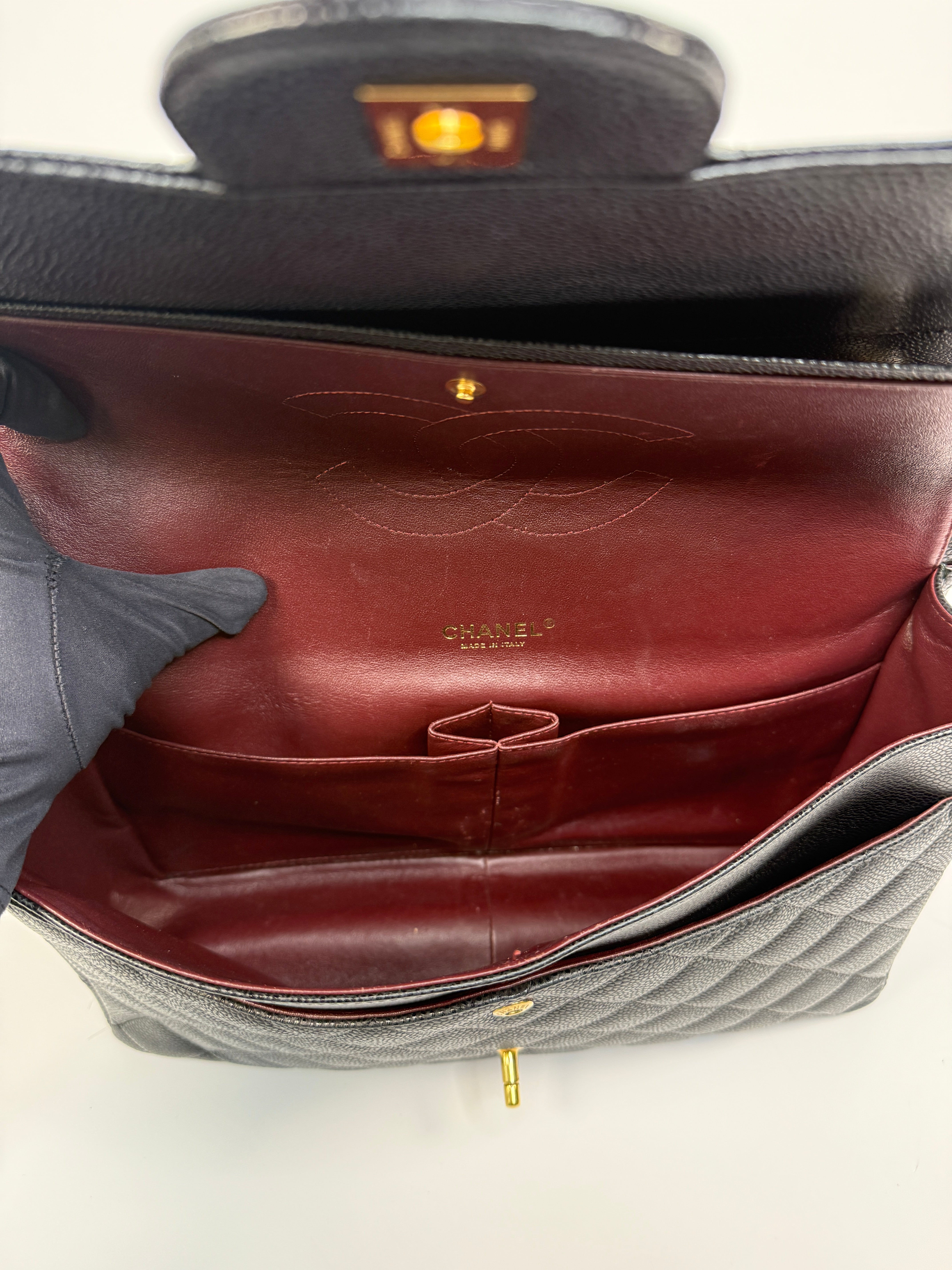 Chanel Maxi Classic Double Flap In Black Caviar Leather With Gold Hardware
Pre Loved & Authentic