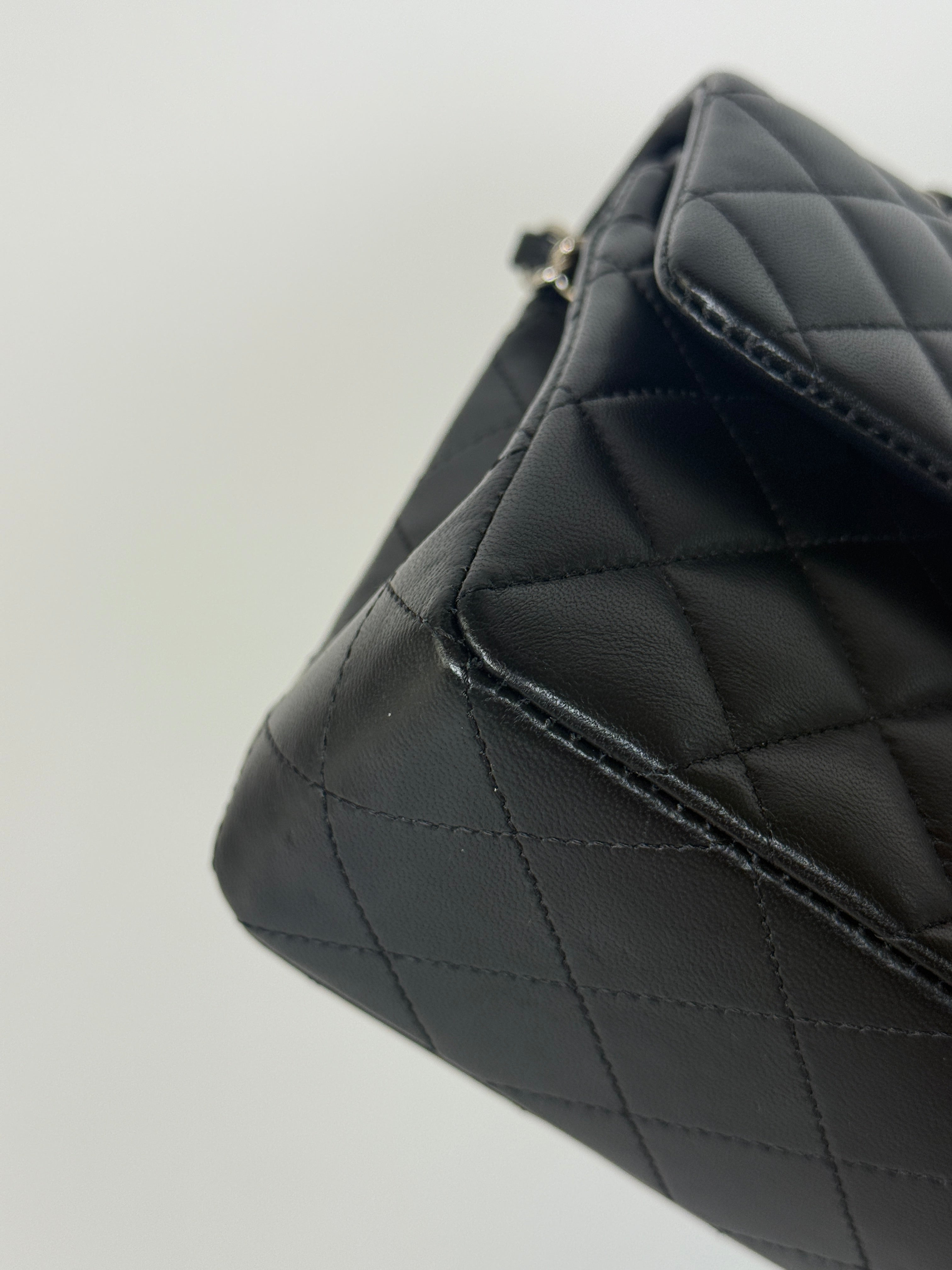 Authentic and preloved Chanel Small Classic Double Flap In Black Lambskin Leather With Silver hardware 100% Authenticity guarantee