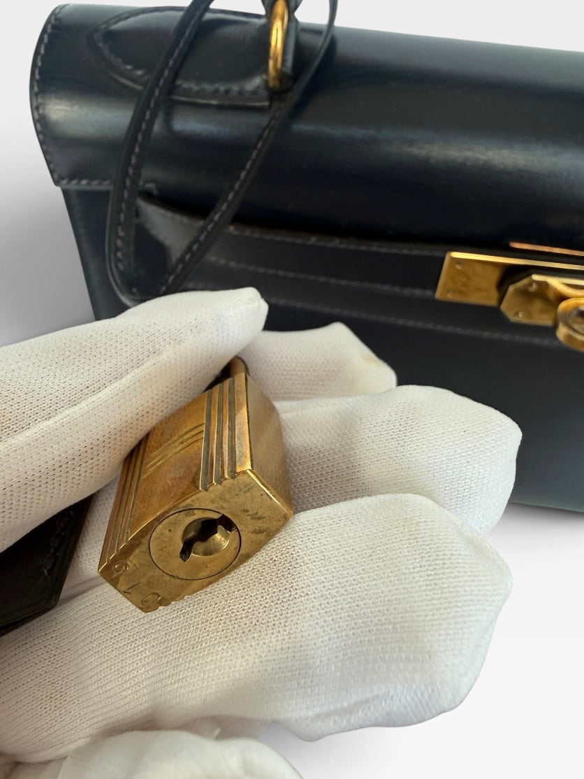 Hermès Vintage Kelly 28 In Navy Sellier Box Leather With Gold Hardware. 100% authentic and preloved in excellent condition.