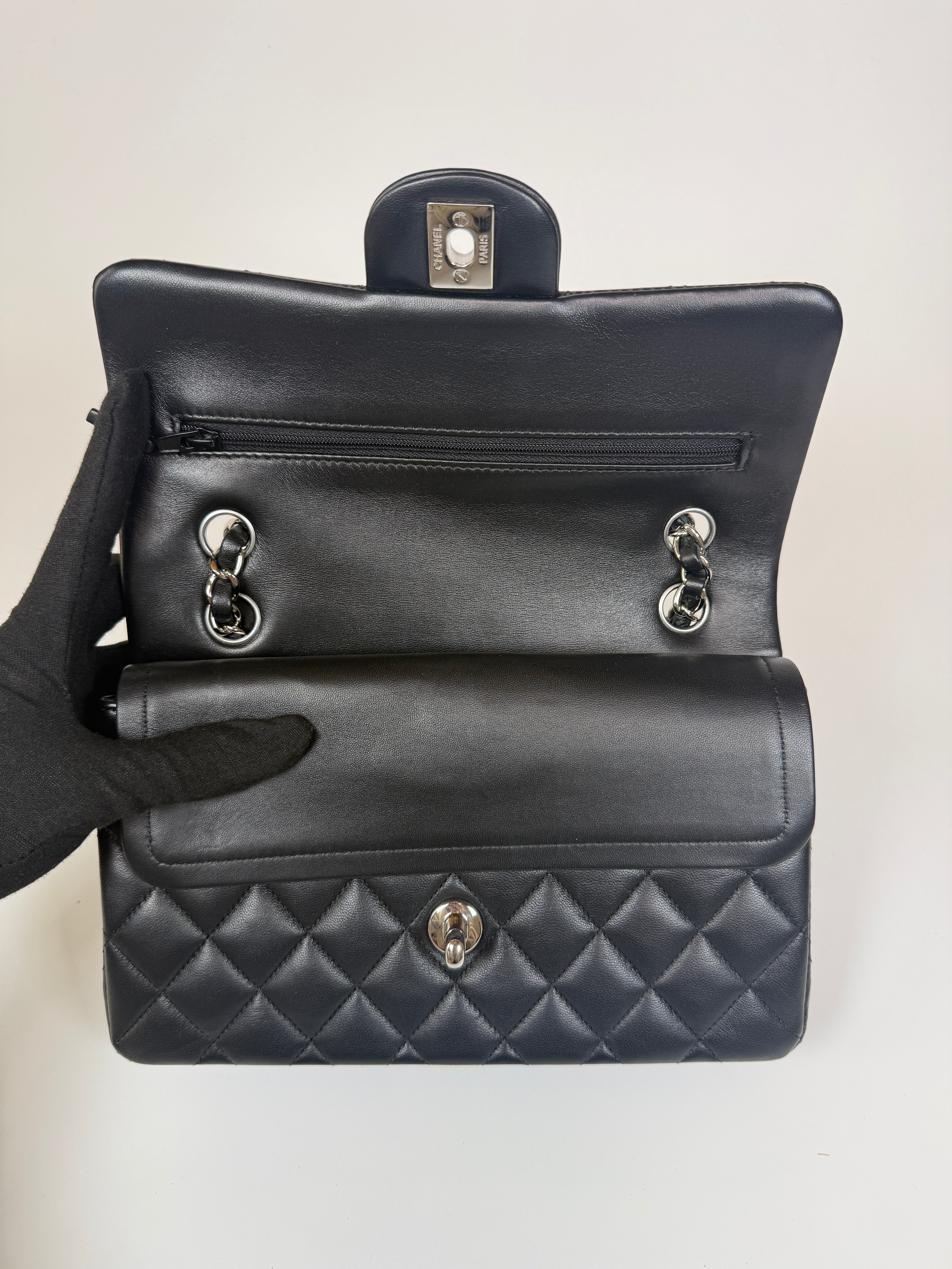 Authentic and preloved Chanel Small Classic Double Flap In Black Lambskin Leather With Silver hardware 100% Authenticity guarantee