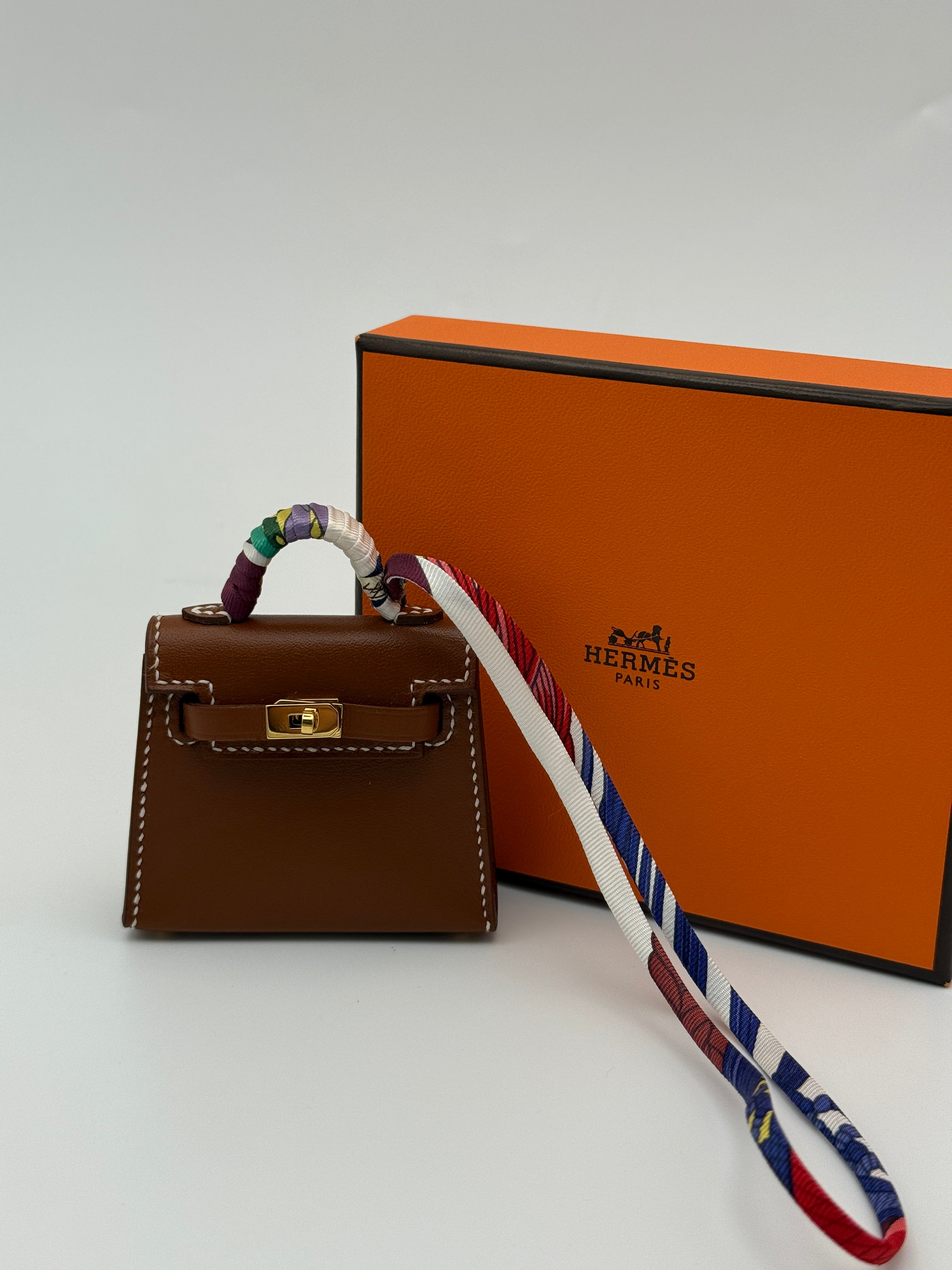 Hermès Kelly Twilly Charm In Gold Tadelakt Leather With GHW