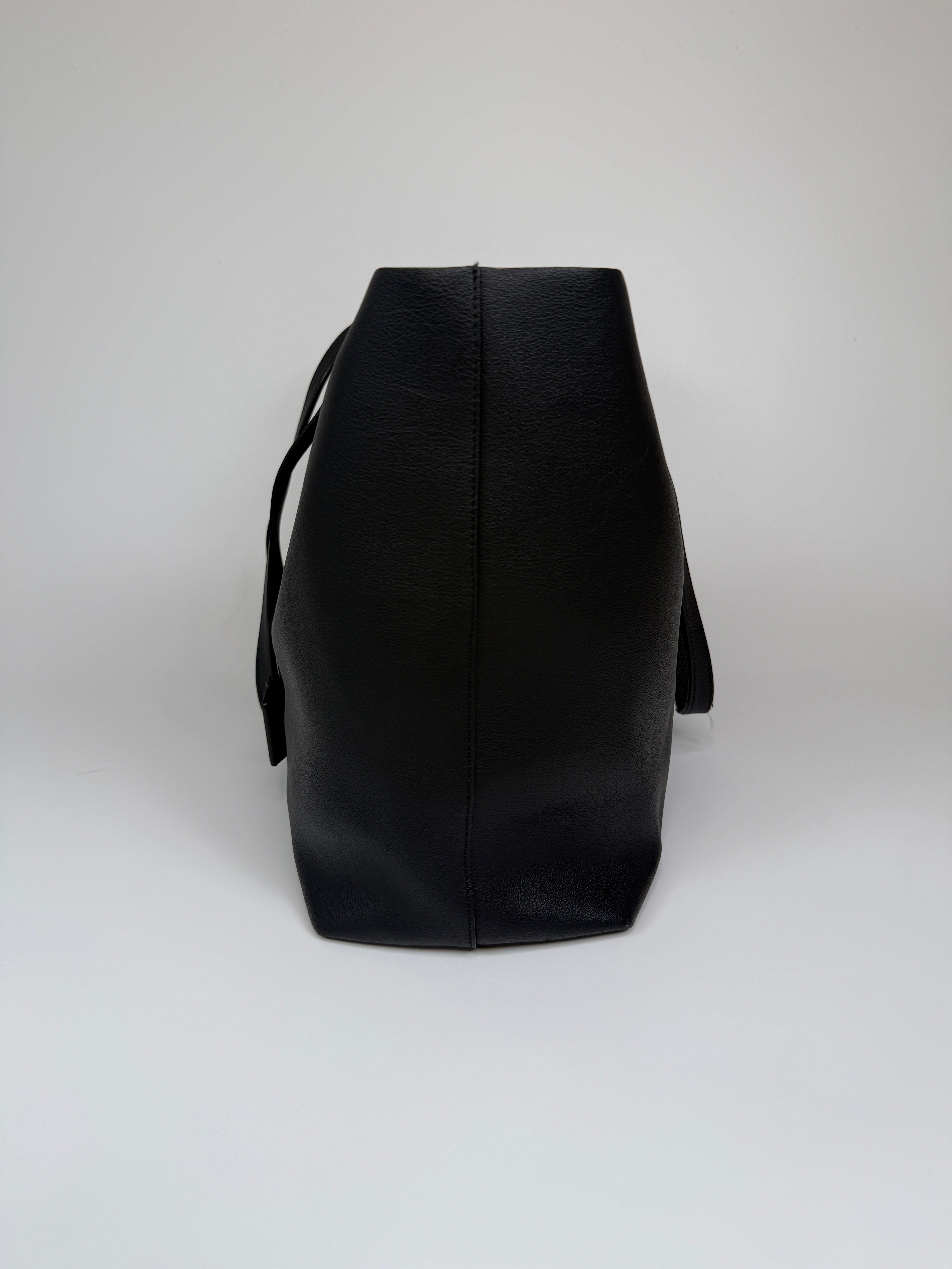aAuthentic and preloved Saint Laurent Shopping Tote In Black Leather. 100% Authenticity guarantee