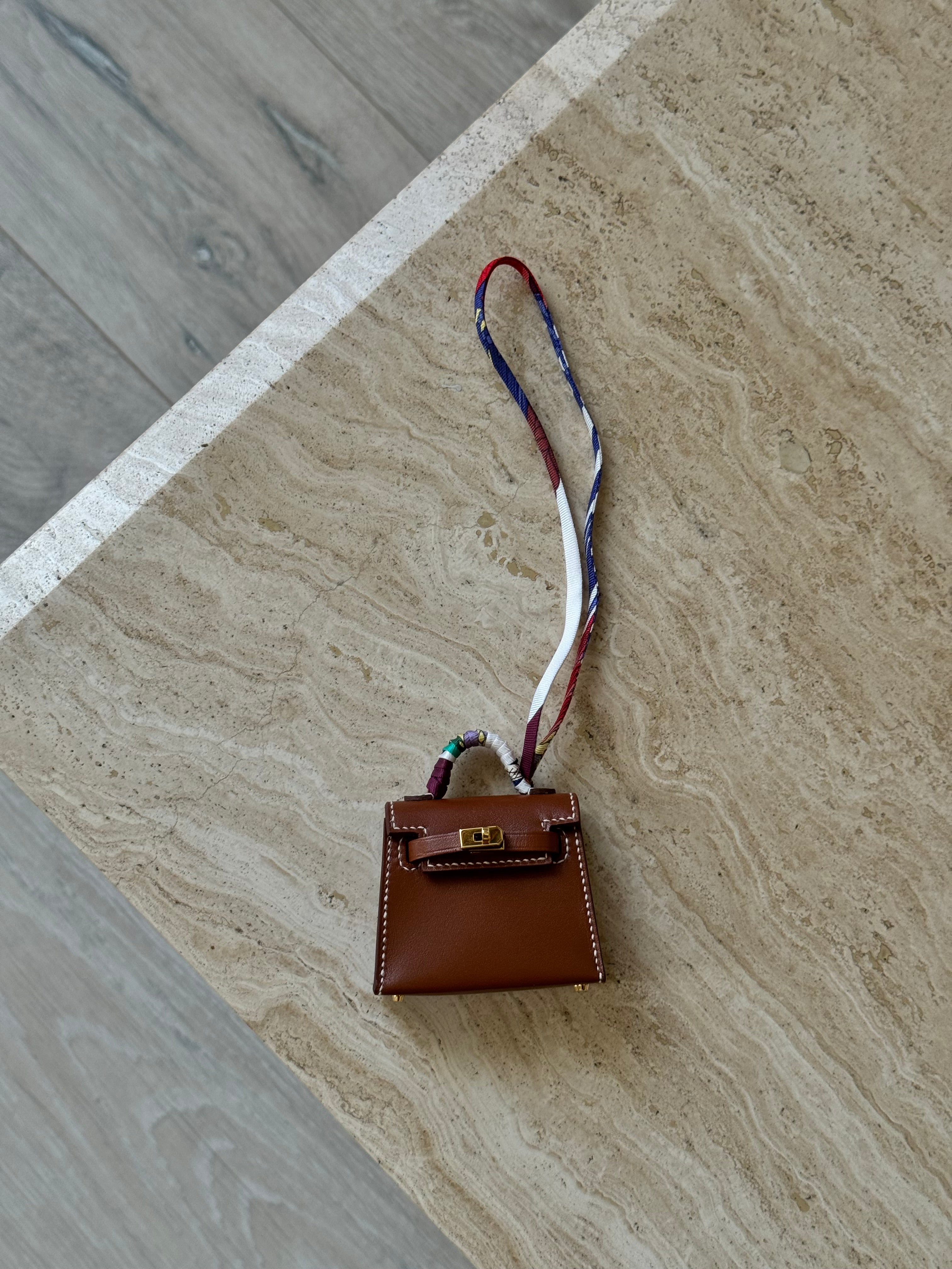 Hermès Kelly Twilly Charm In Gold Tadelakt Leather With GHW