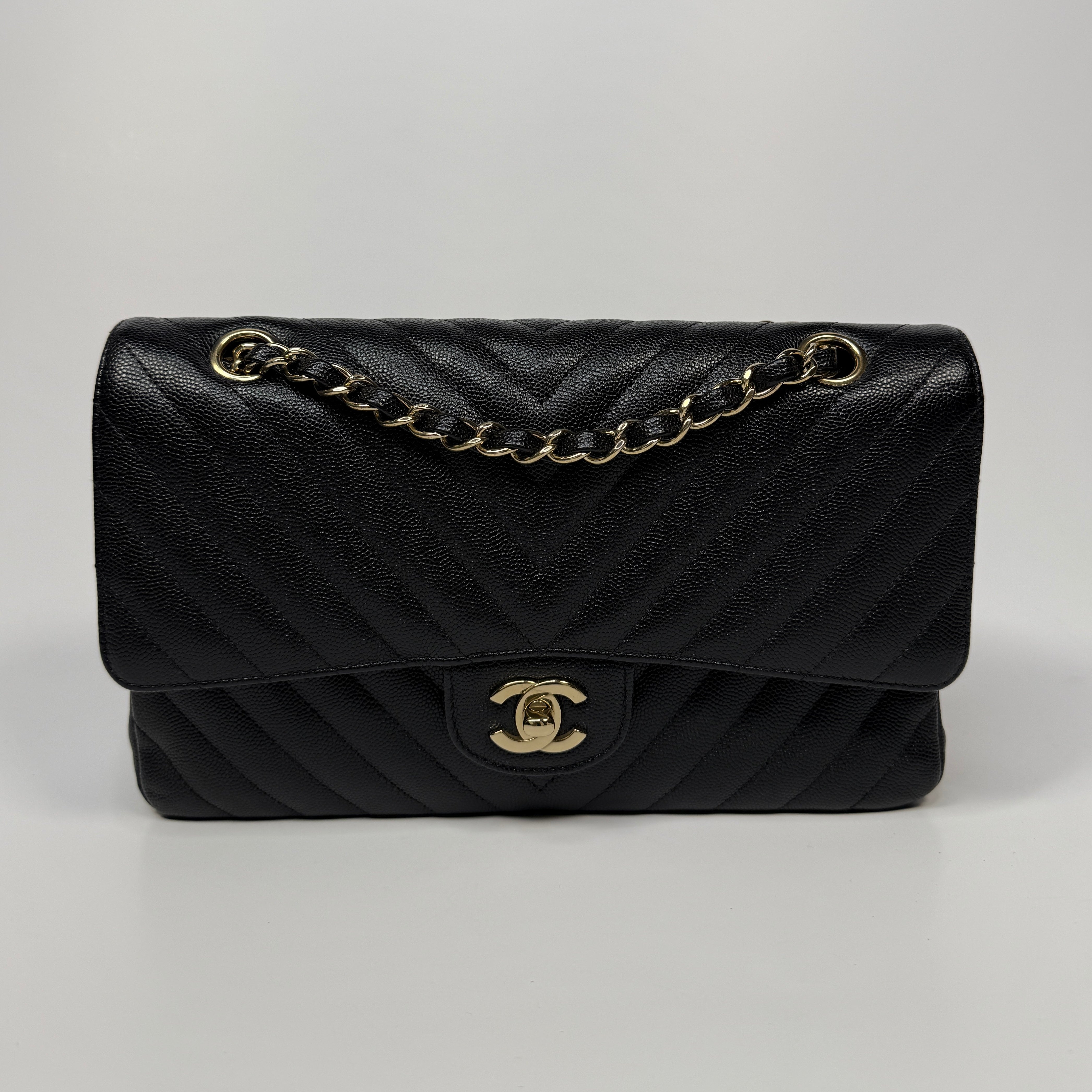Authentic and pre loved. Chanel Medium Classic Double Flap Chevron Black Caviar Leather With Pale Gold Hardware. Excellent Condition. 100% Authenticity guarantee.