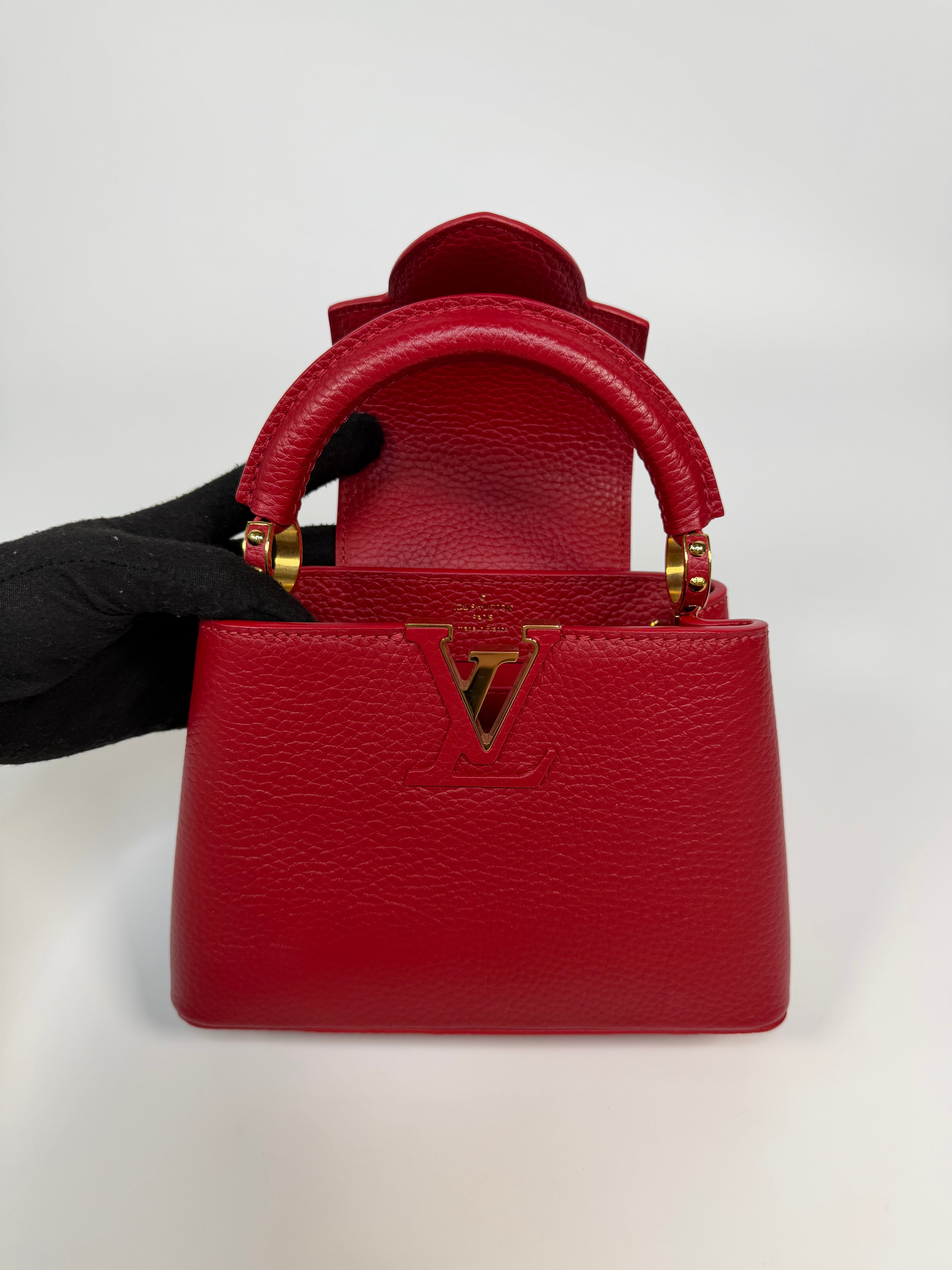 Louis Vuitton Capucines BB Bag In Scarlet Taurillion Leather With Gold Hardware. Authentic and preloved in excellent condition