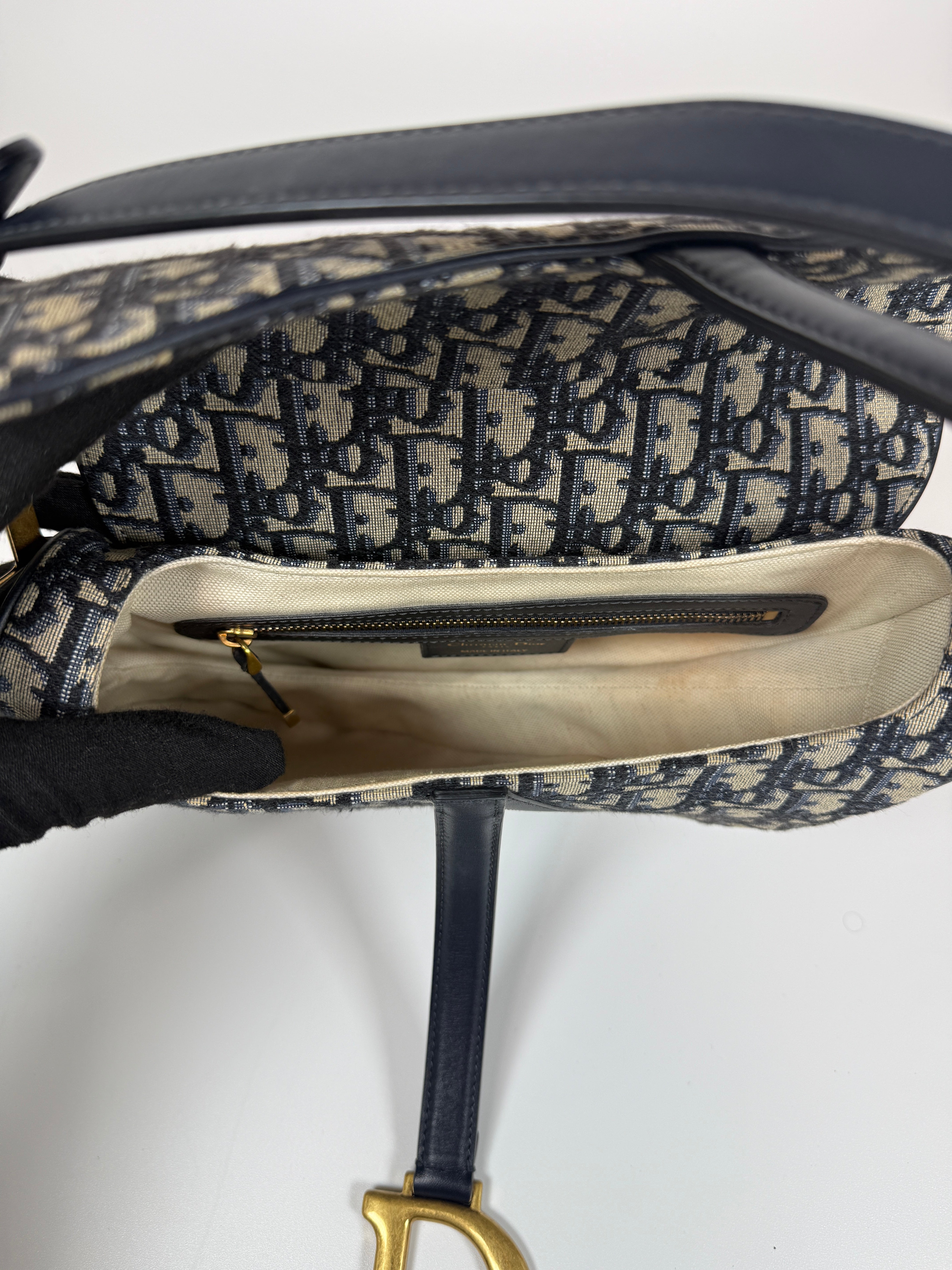Authentic and preloved Christian Dior Saddle Bag In Oblique Canvas With Gold Hardware. Excellent condition. 100% Authenticity Guarantee