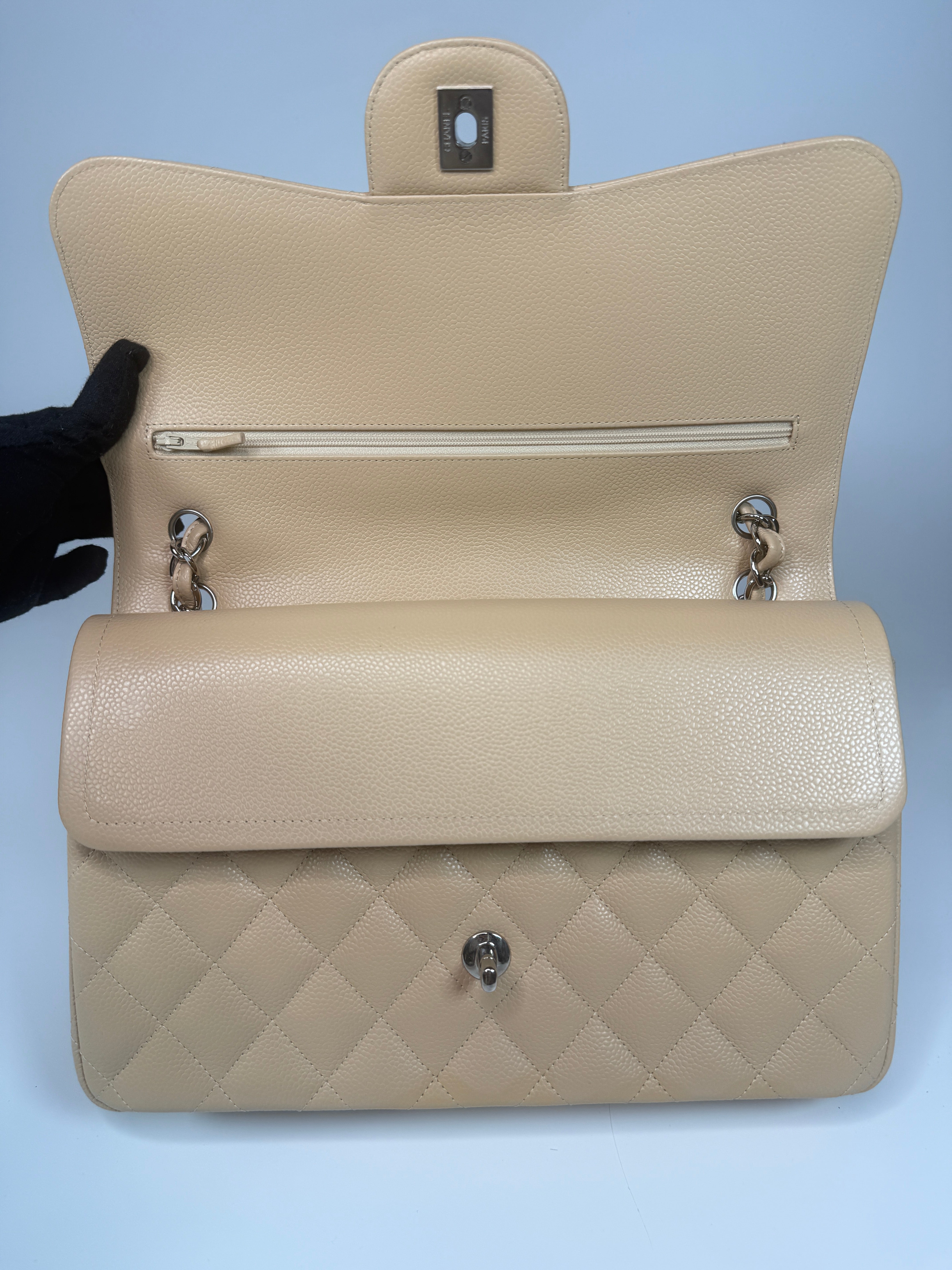 Authentic and preloved Chanel Jumbo Classic Flap Bag In Beige Caviar Leather With Silver Hardware. 100% Authenticity guarantee. Verified by Luxe Cheshire. Fully Insured next day delivery