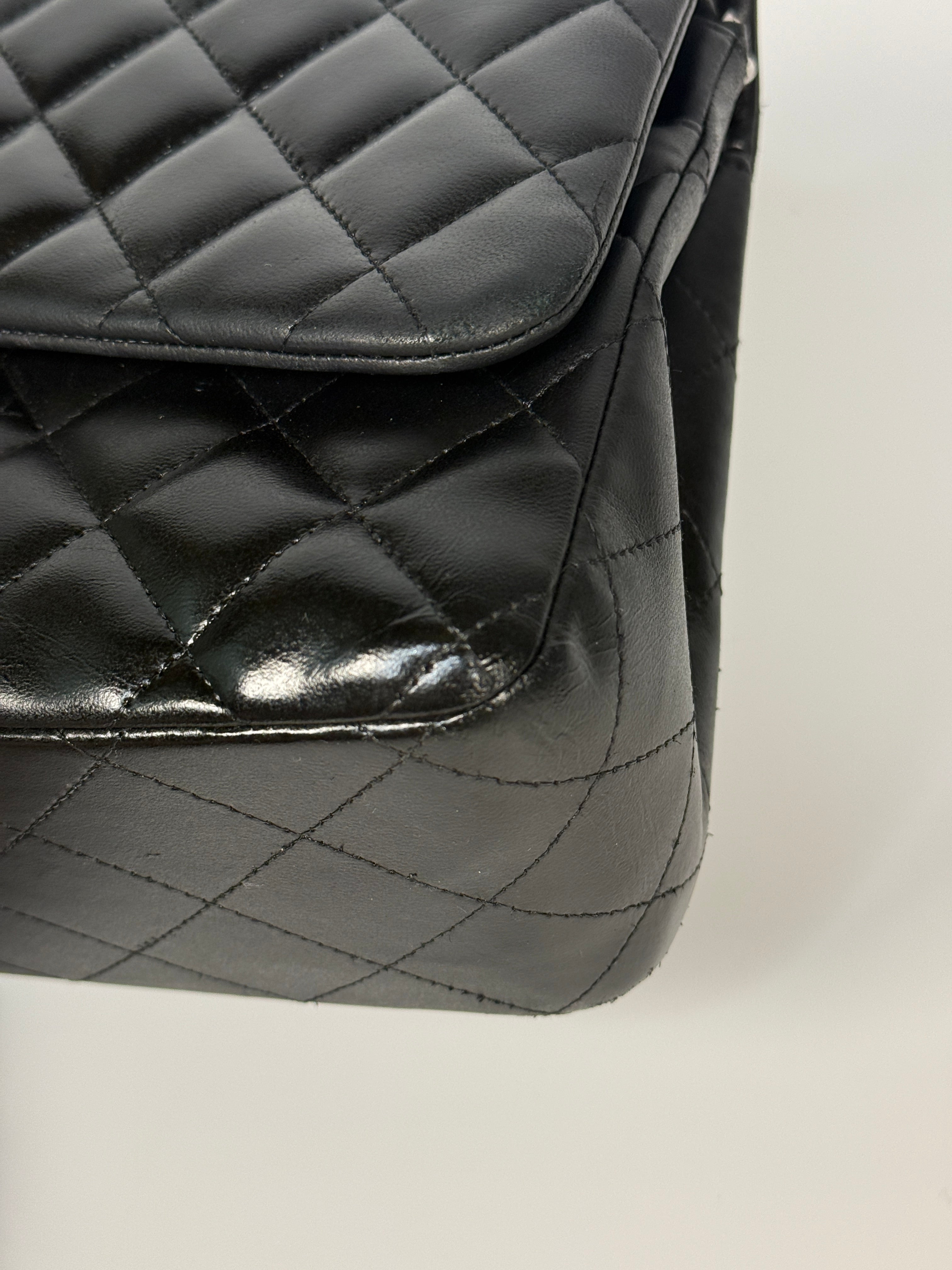 Authentic and preloved Chanel Jumbo Classic Flap Bag In Black Lambskin Leather With Silver hardware. Very Good condition. 100% Authenticity guarantee