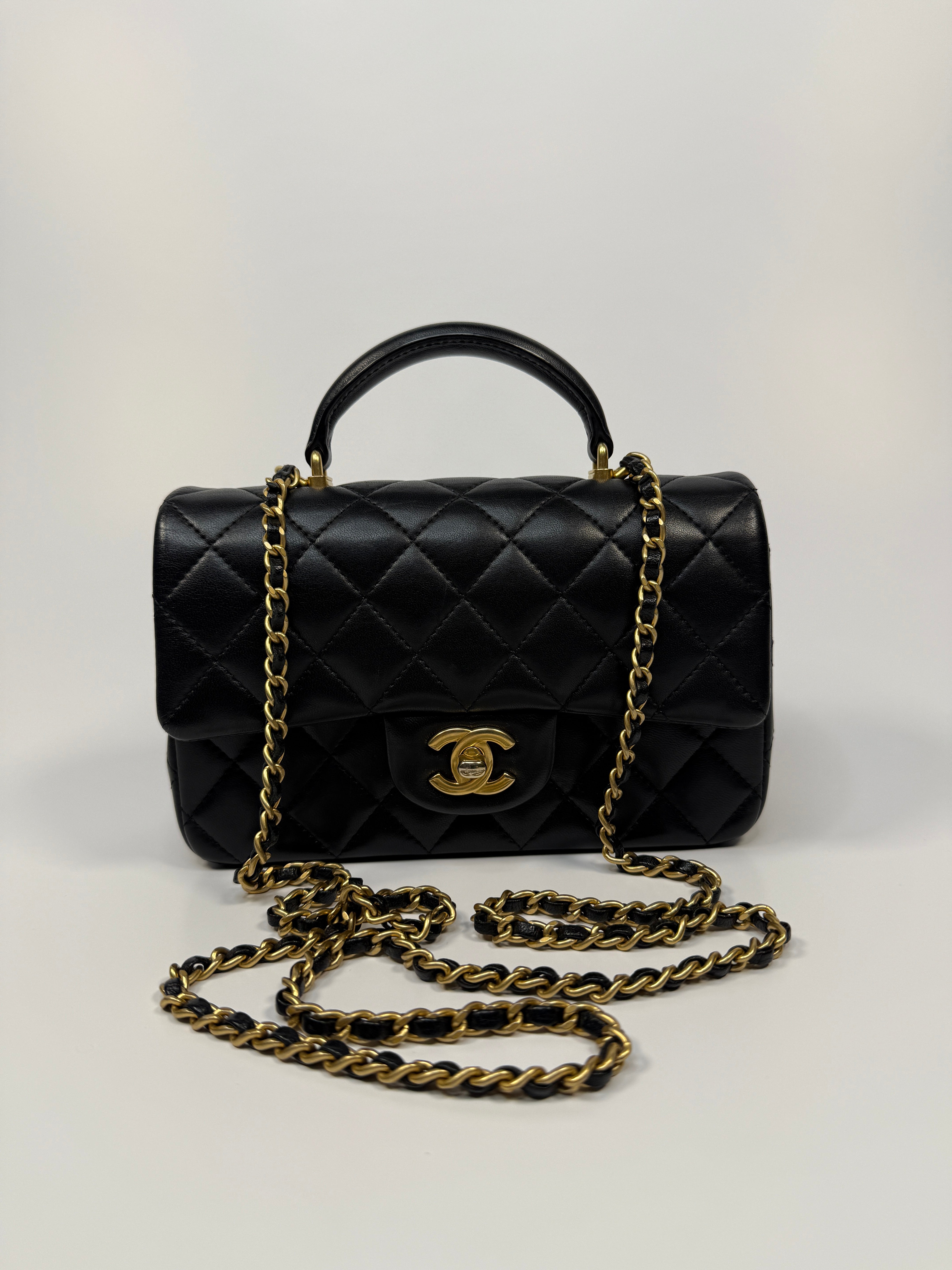 Chanel Mini Rectangle Top Handle Flap Bag In Black Lambskin With Gold Hardware
Pre Loved & Authentic
