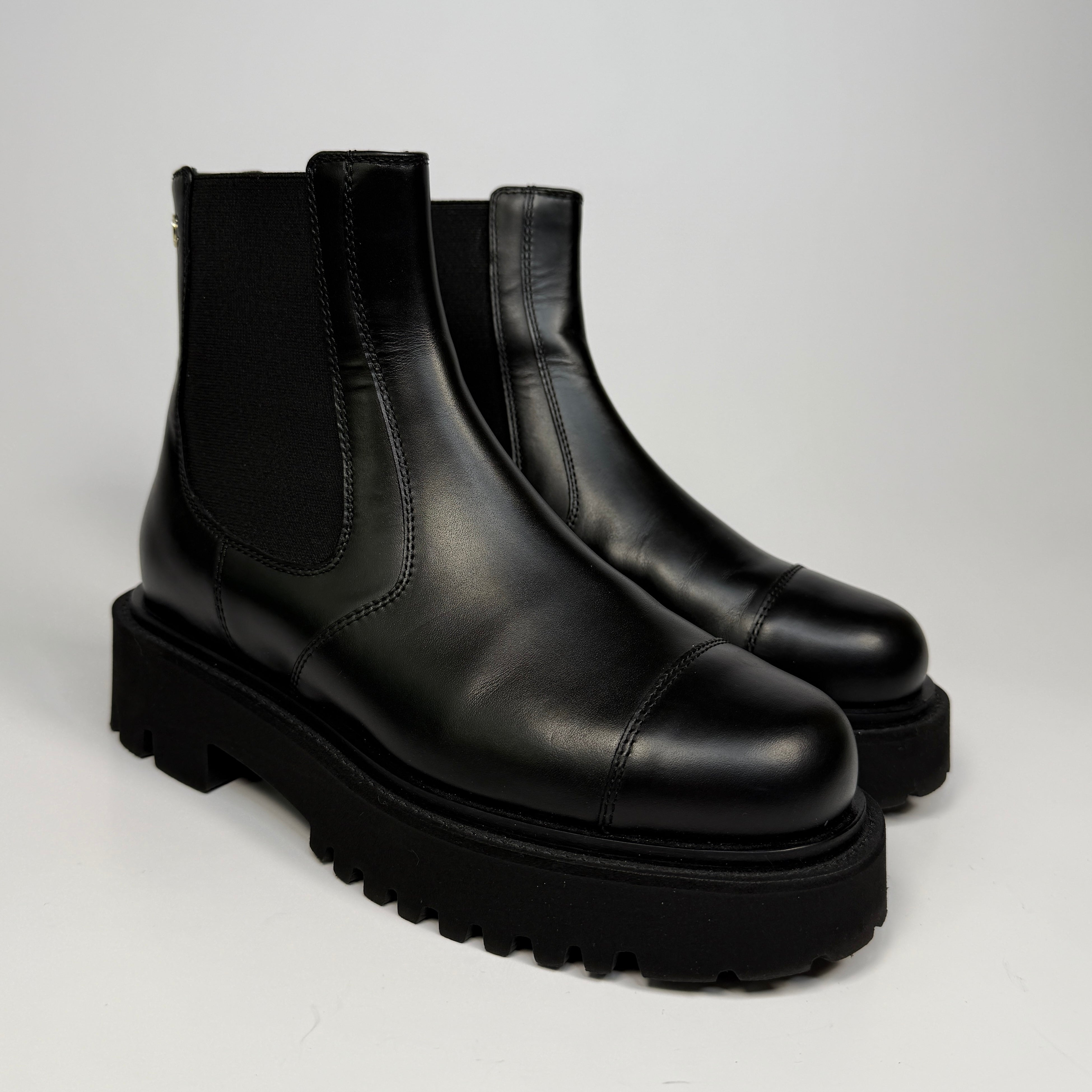 Chanel CC Boots (Size 38/UK5) in black leather. Excellent condition. Authentic and preloved