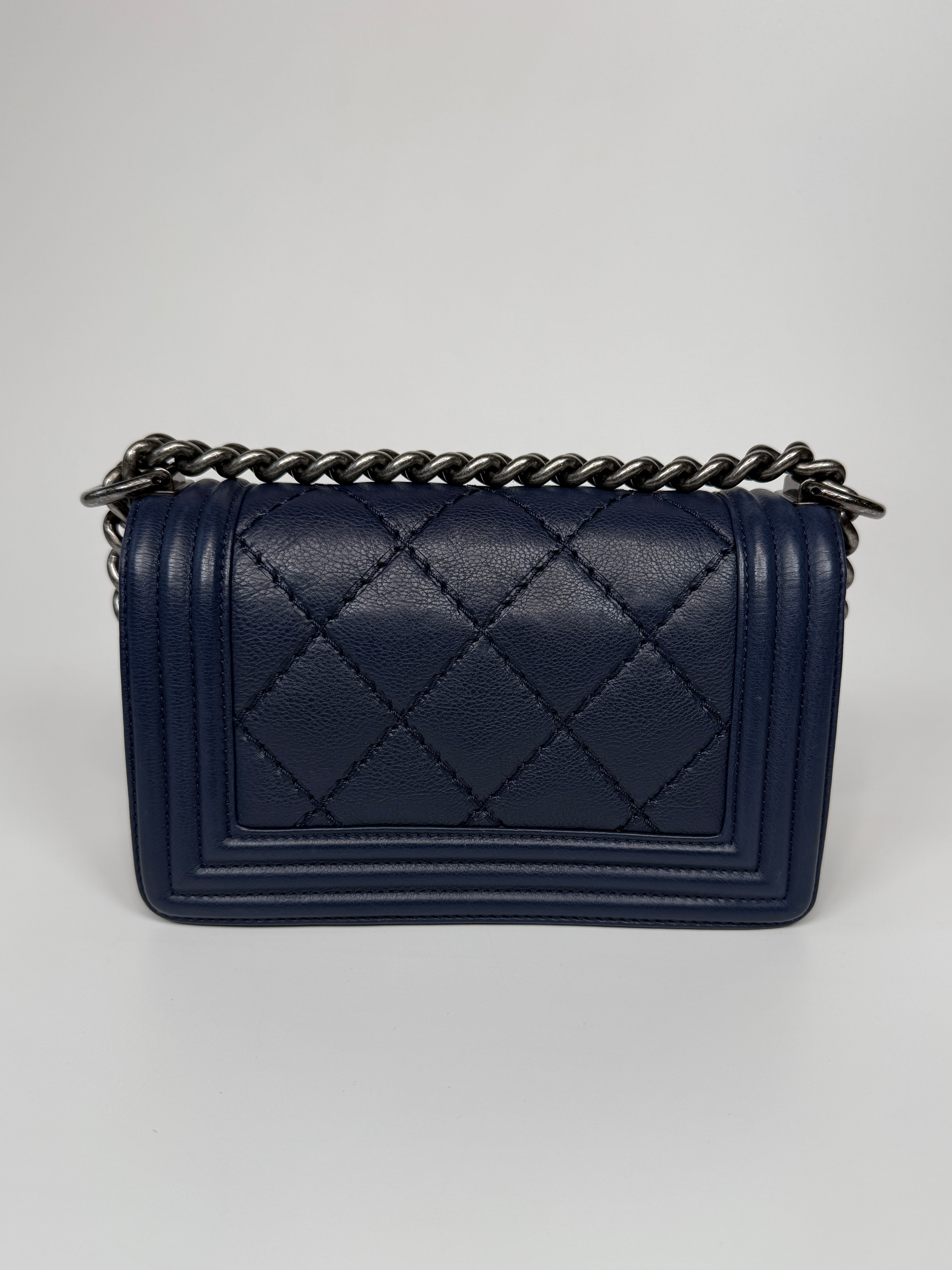 Chanel Mini Boy Bag In Navy Lambskin With Ruthenium Hardware In Excellent Condition.
Authentic Pre Loved Verified by Luxe Cheshire Trusted Designer resale