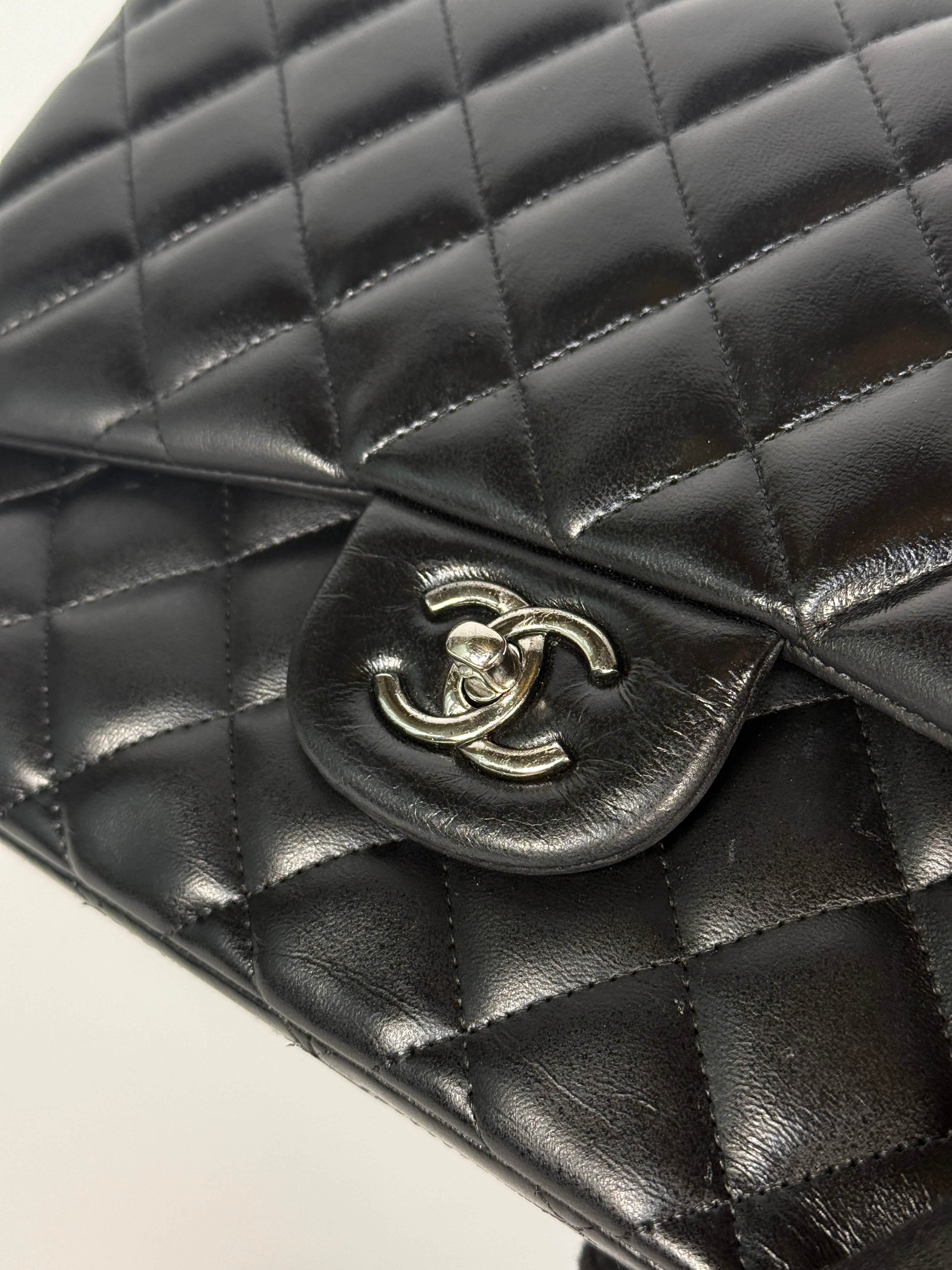 Authentic and preloved Chanel Jumbo Classic Flap Bag In Black Lambskin Leather With Silver hardware. Very Good condition. 100% Authenticity guarantee
