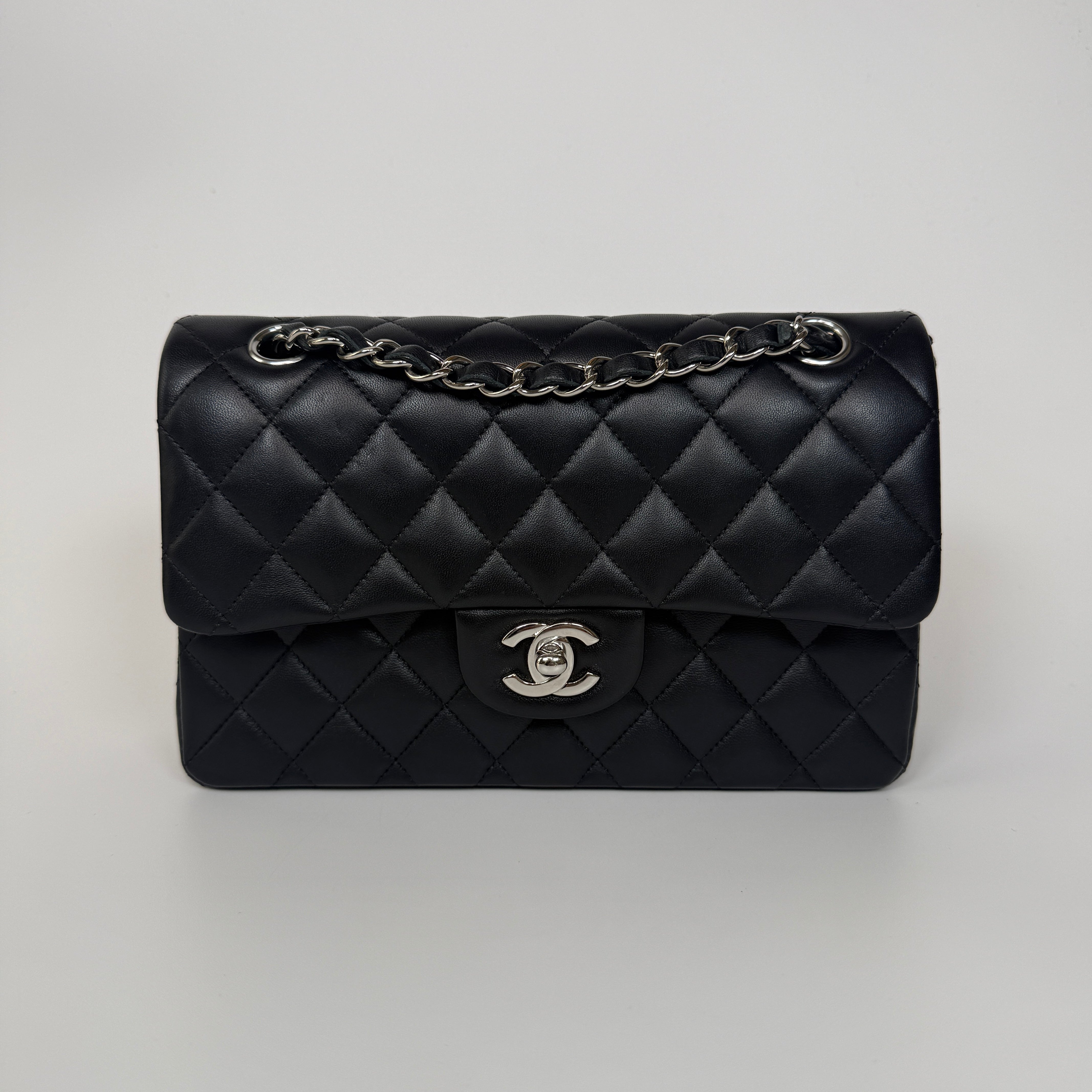Authentic and preloved Chanel Small Classic Double Flap In Black Lambskin Leather With Silver hardware 100% Authenticity guarantee