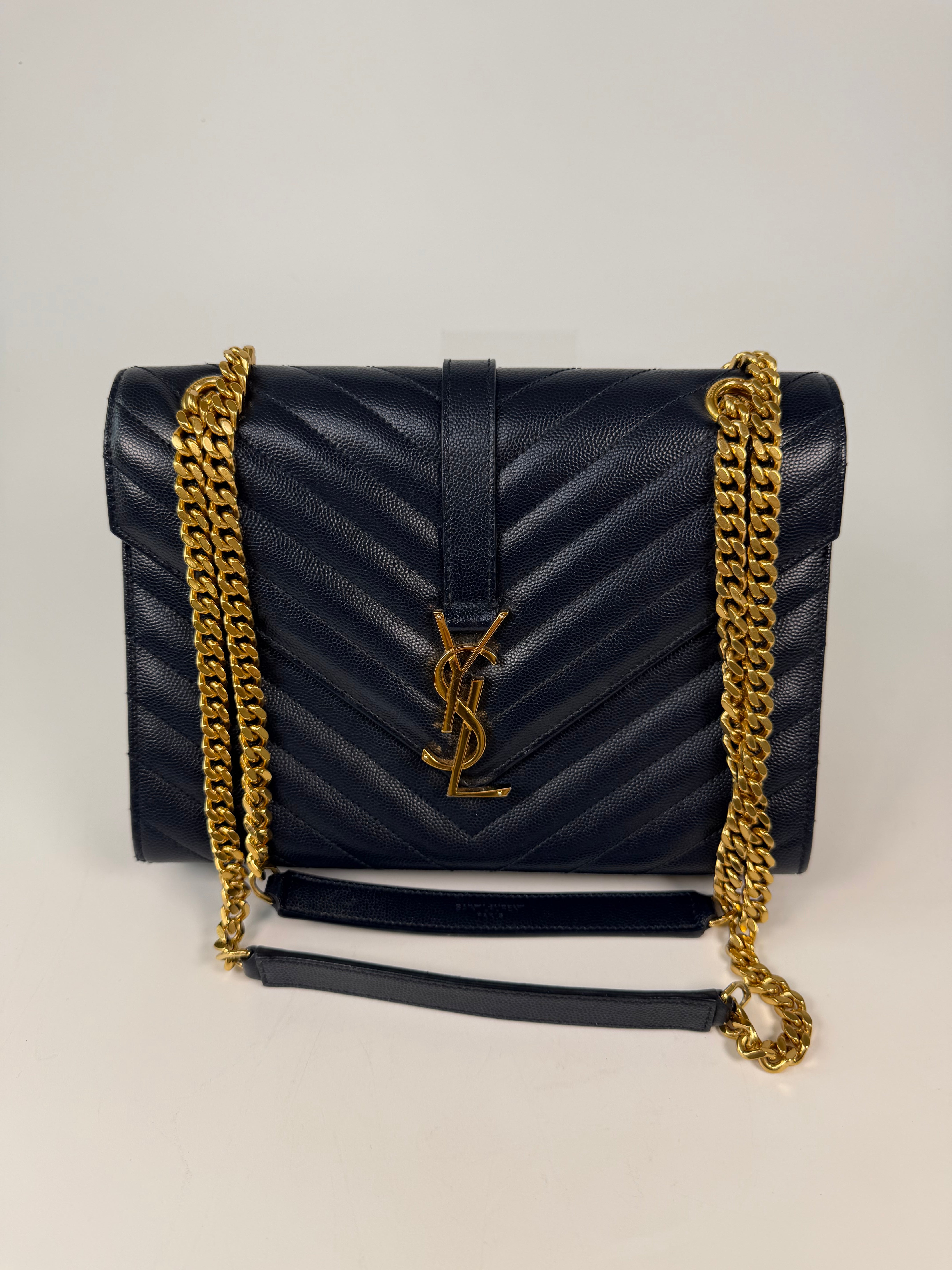 Authentic and pre loved Saint Laurent Medium Envelope Bag In Blue Grained Leather With Gold Hardware. Excellent Condition. Verified by Luxe Cheshire