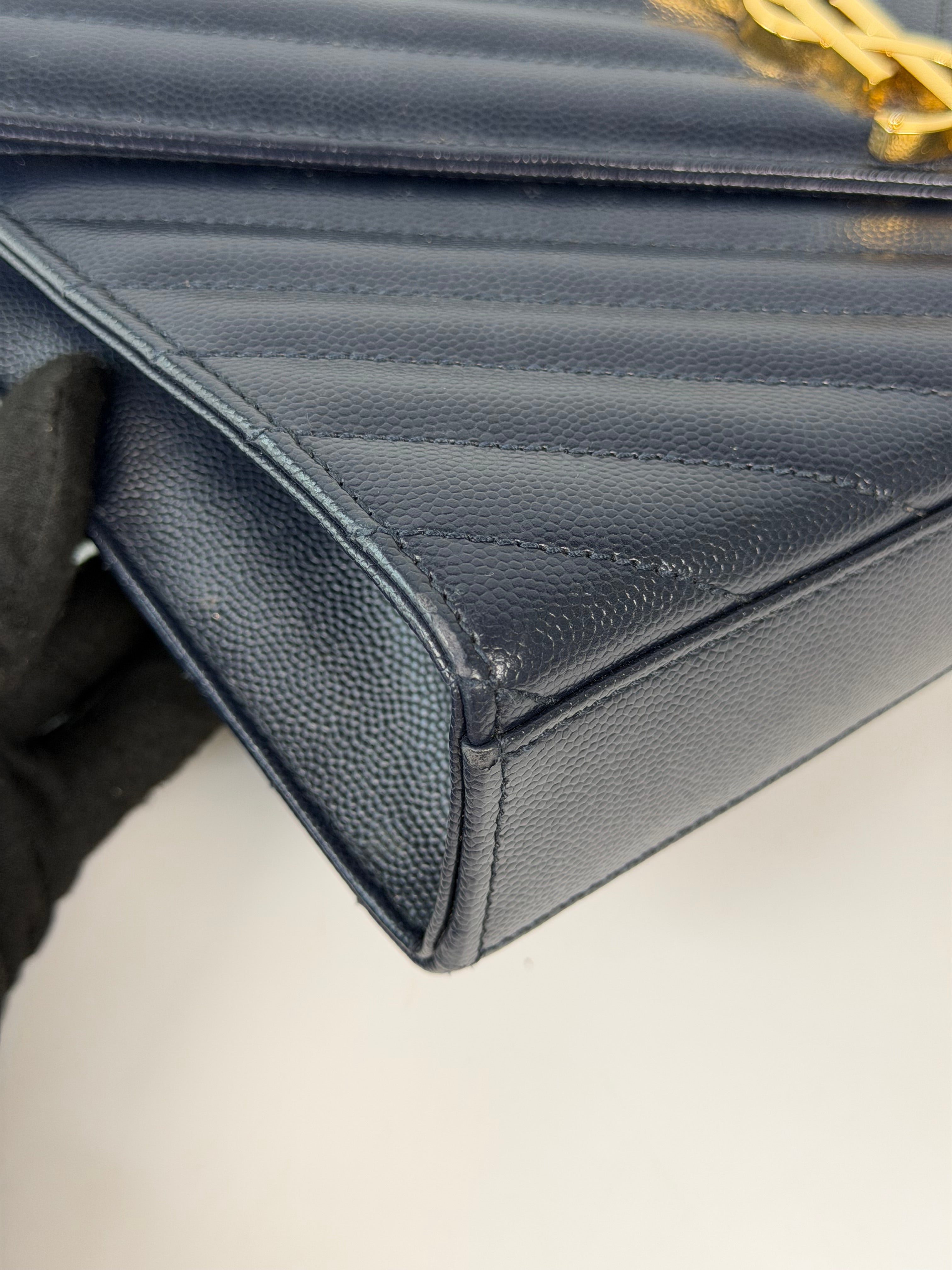 Authentic and pre loved Saint Laurent Medium Envelope Bag In Blue Grained Leather With Gold Hardware. Excellent Condition. Verified by Luxe Cheshire