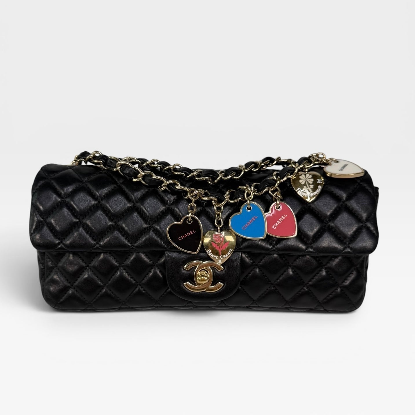 Chanel East West Charms Bag In Black Lambskin Leather With Gold Hardware. Authentic and preloved in excellent condition. 100% guarantee