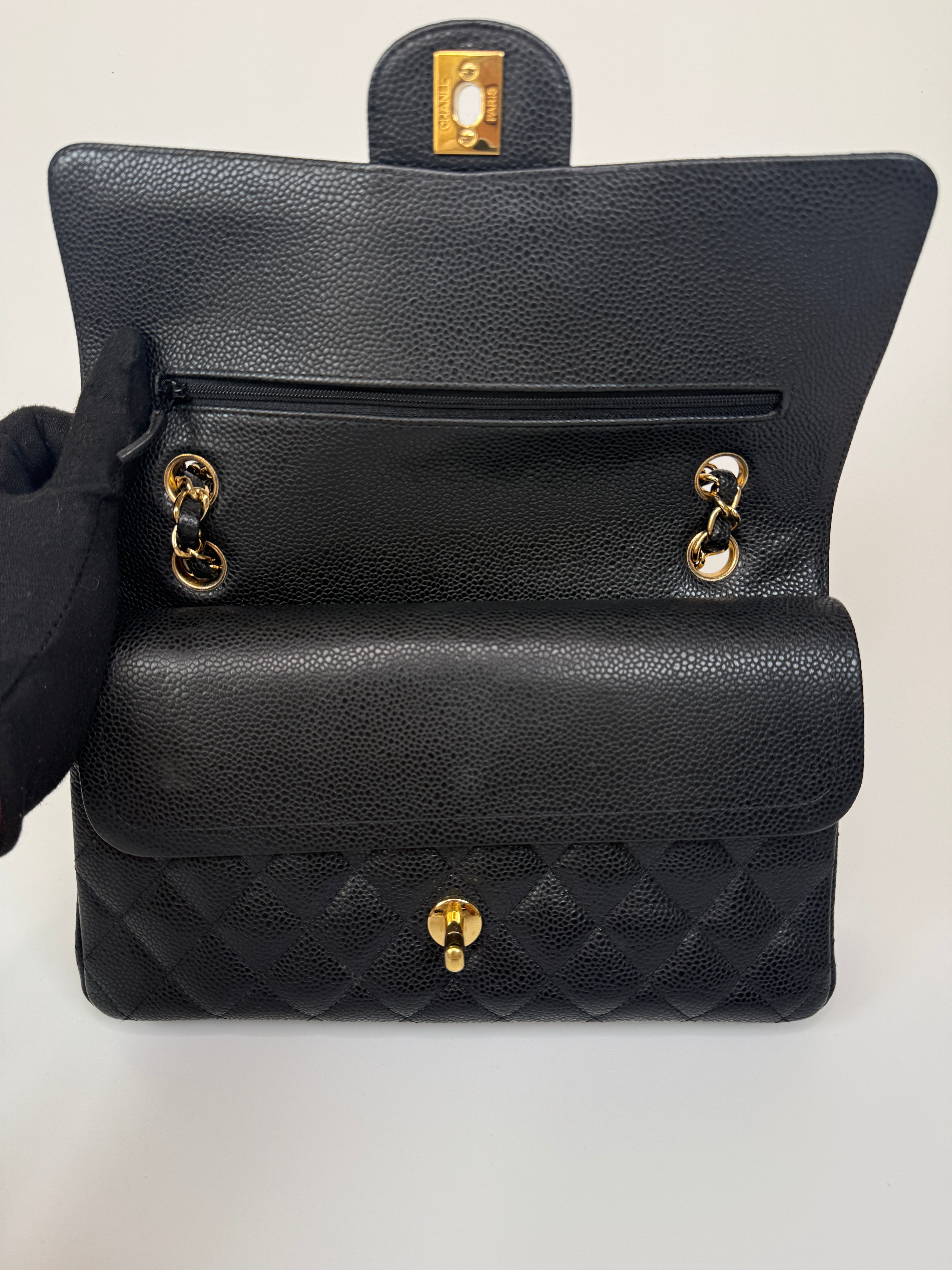 Chanel Medium Classic Double Flap Black Caviar Leather With Gold Hardware. Authentic and preloved. 100% Authenticity guarantee