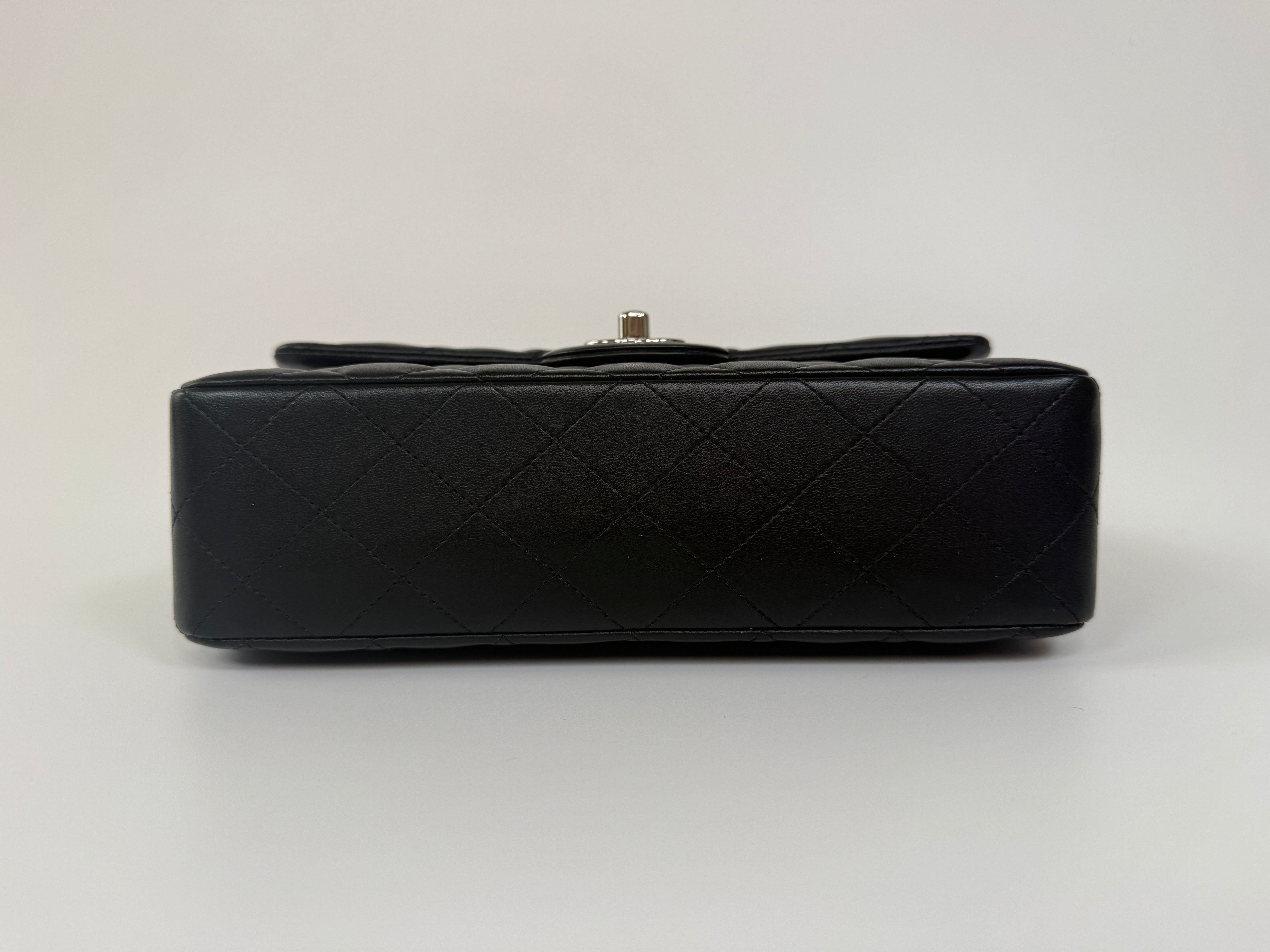 Chanel Small Classic Double Flap In Black Lambskin Leather With Silver Hardware Authentic and preloved in excellent condition. 100% Authenticity guarantee