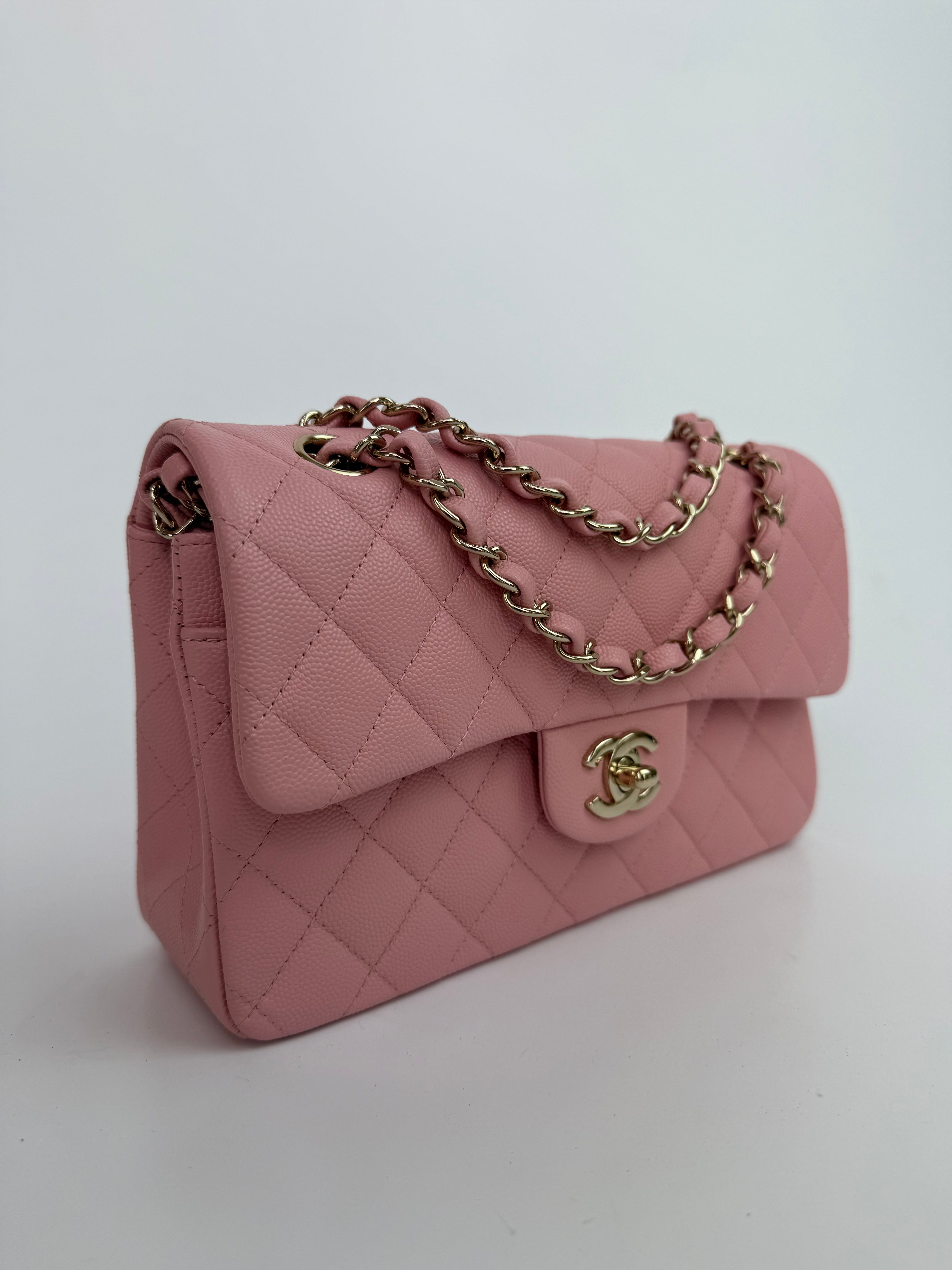 Authentic pre-loved Chanel Small Classic Double Flap In Pink Caviar Leather With Gold Hardware.
