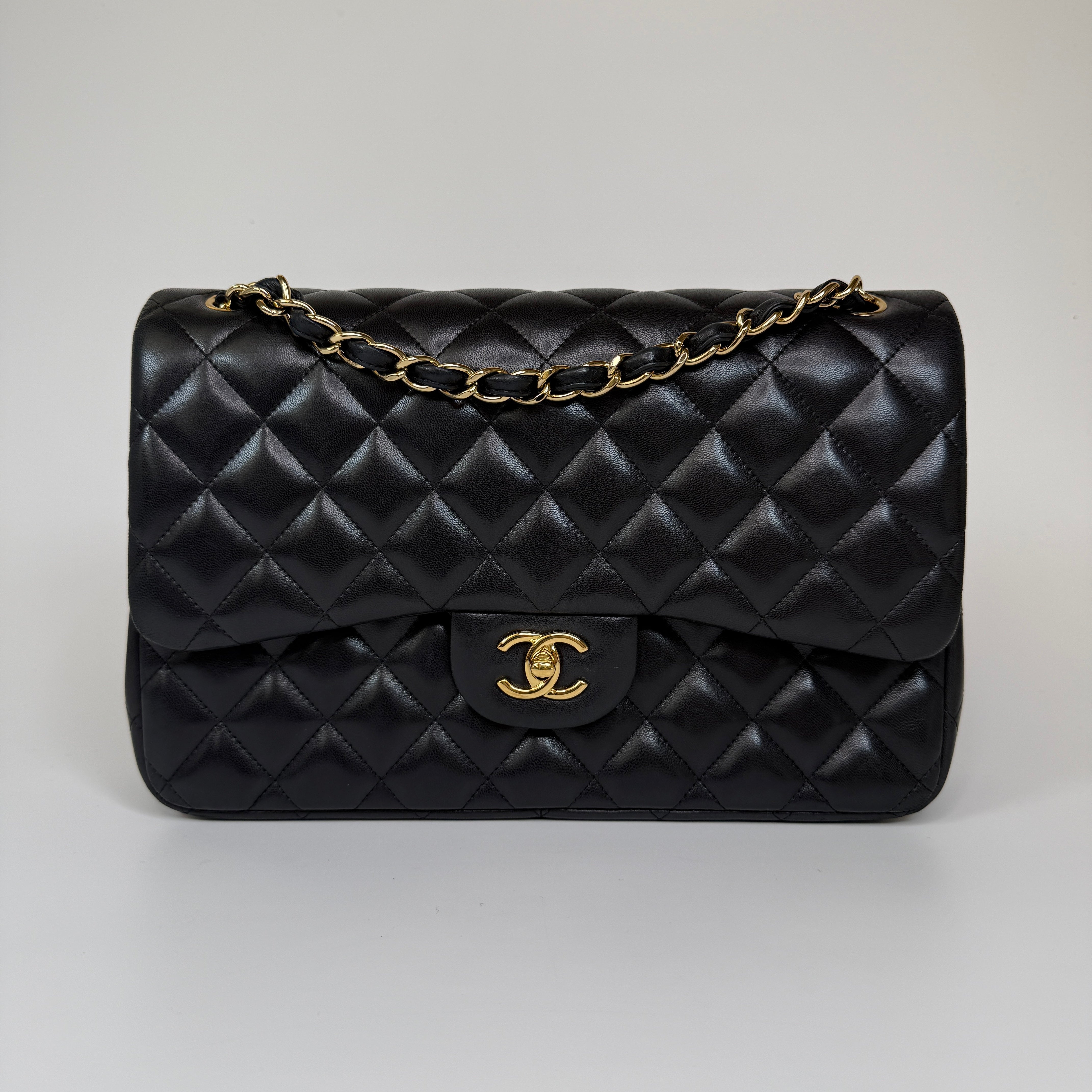 Authentic and preloved Chanel Jumbo Classic Flap Bag In Black Lambskin Leather With GOLD Hardware. Excellent condition. 100% Authenticity Guarantee