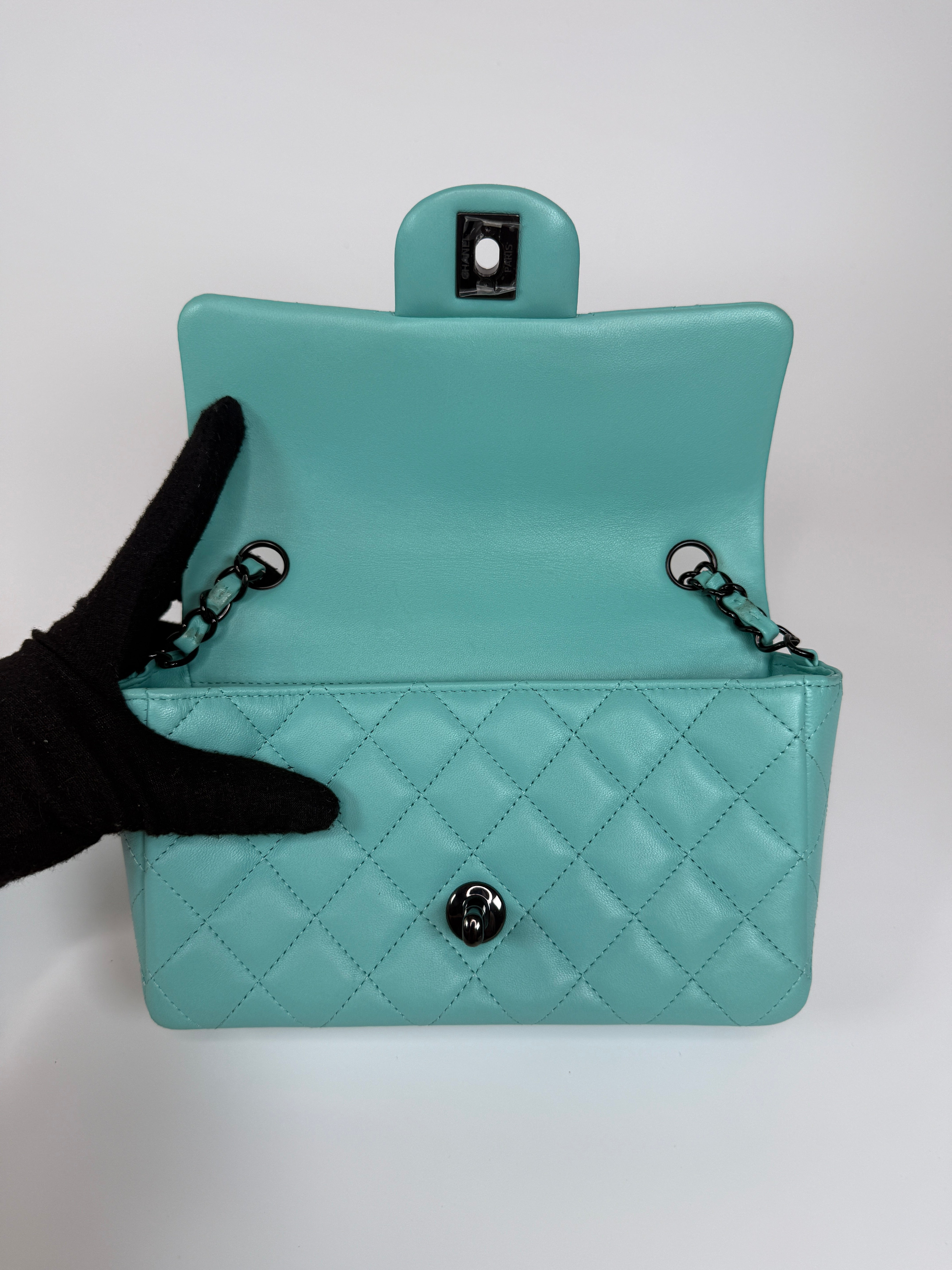 Authentic and preloved Chanel Mini Rectangle Flap Bag In Turquoise Lambskin Leather With Gunmetal Hardware In Excellent condition. Verified by Luxe Cheshire. 100% Authenticity Guarantee.