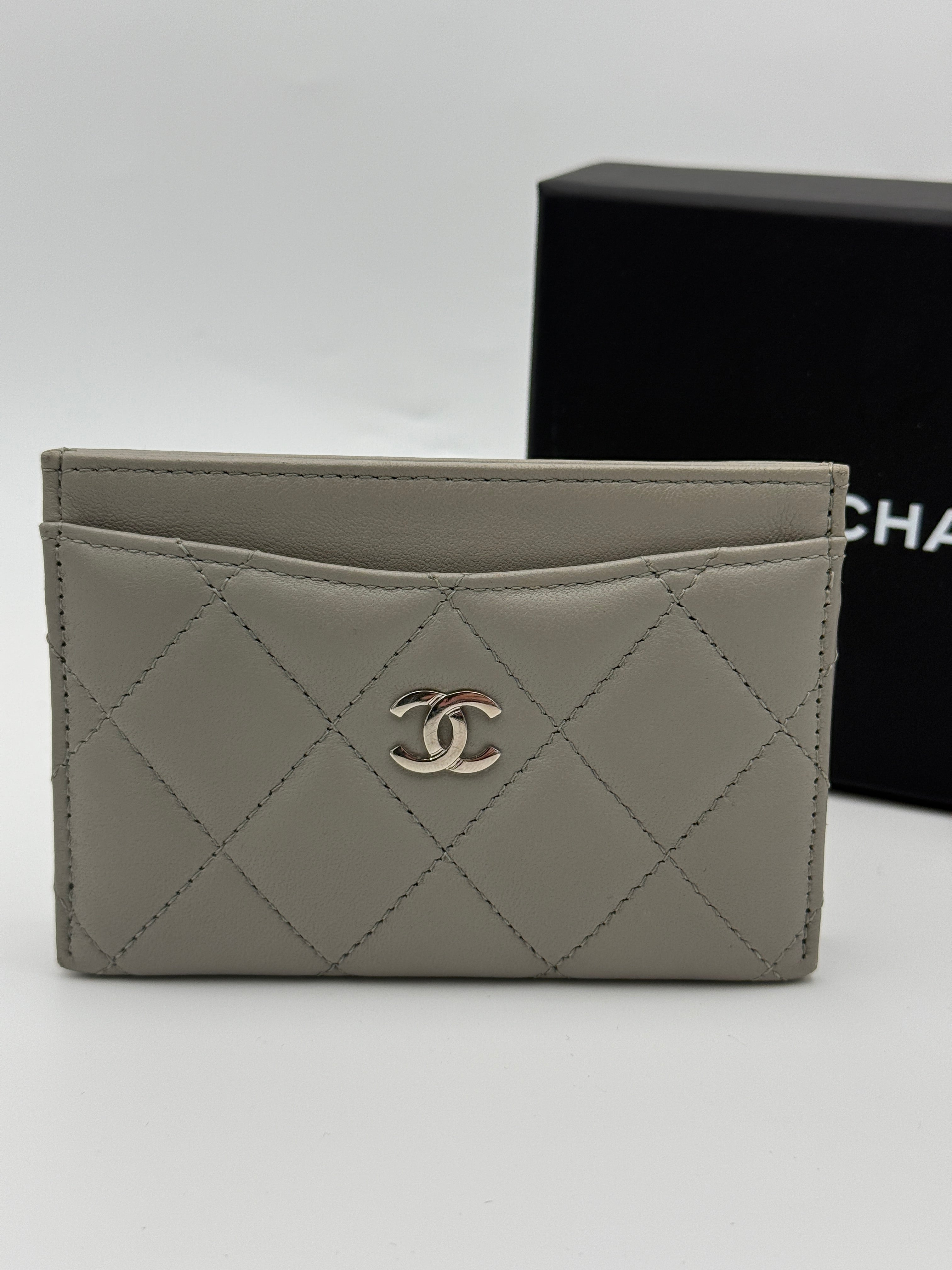 Authentic and pre loved Chanel Classic Card Holder In Grey Lambskin Leather With Silver hardware. Excellent Condition. 100% Authenticity guarantee.