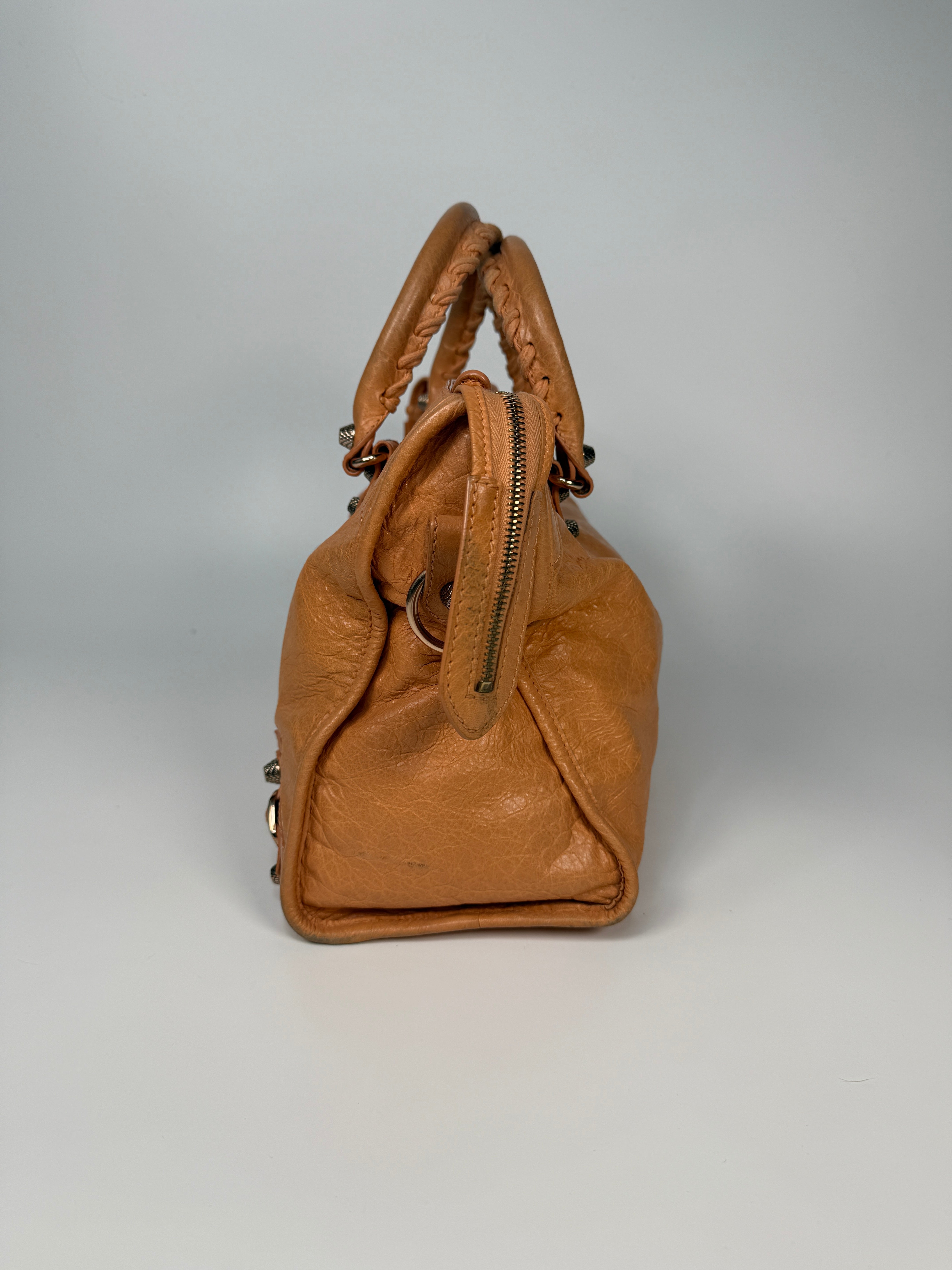 Authentic and preloved Balenciaga Medium Le City Bag In Peach Leather with silver hardware. Very good condition. 100% Authenticity guarantee.