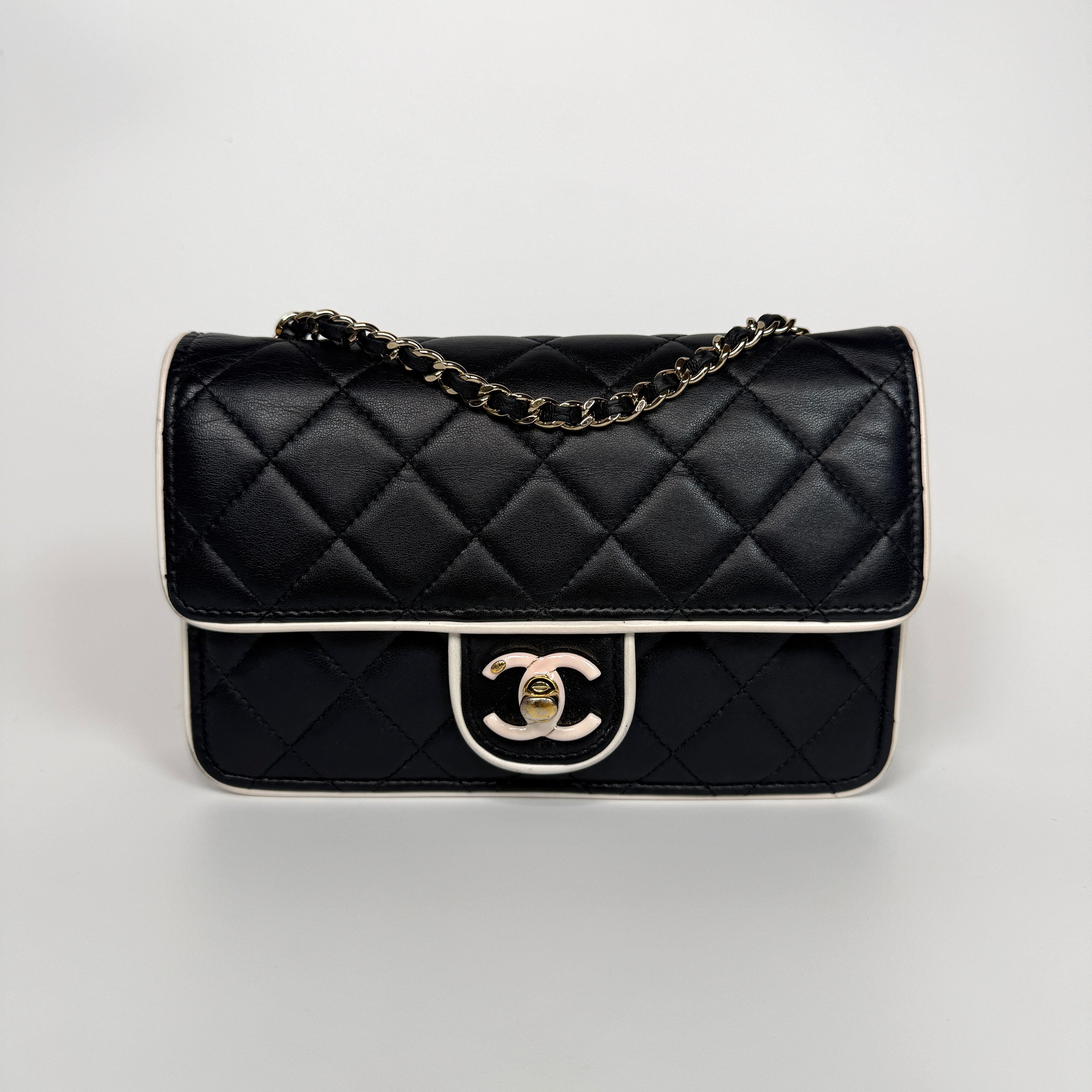 Authentic and preloved Chanel Wallet On Chain In Black & White Lambskin Leather With Pale Gold Hardware. Very Good Condition. 100% Authenticity Guarantee