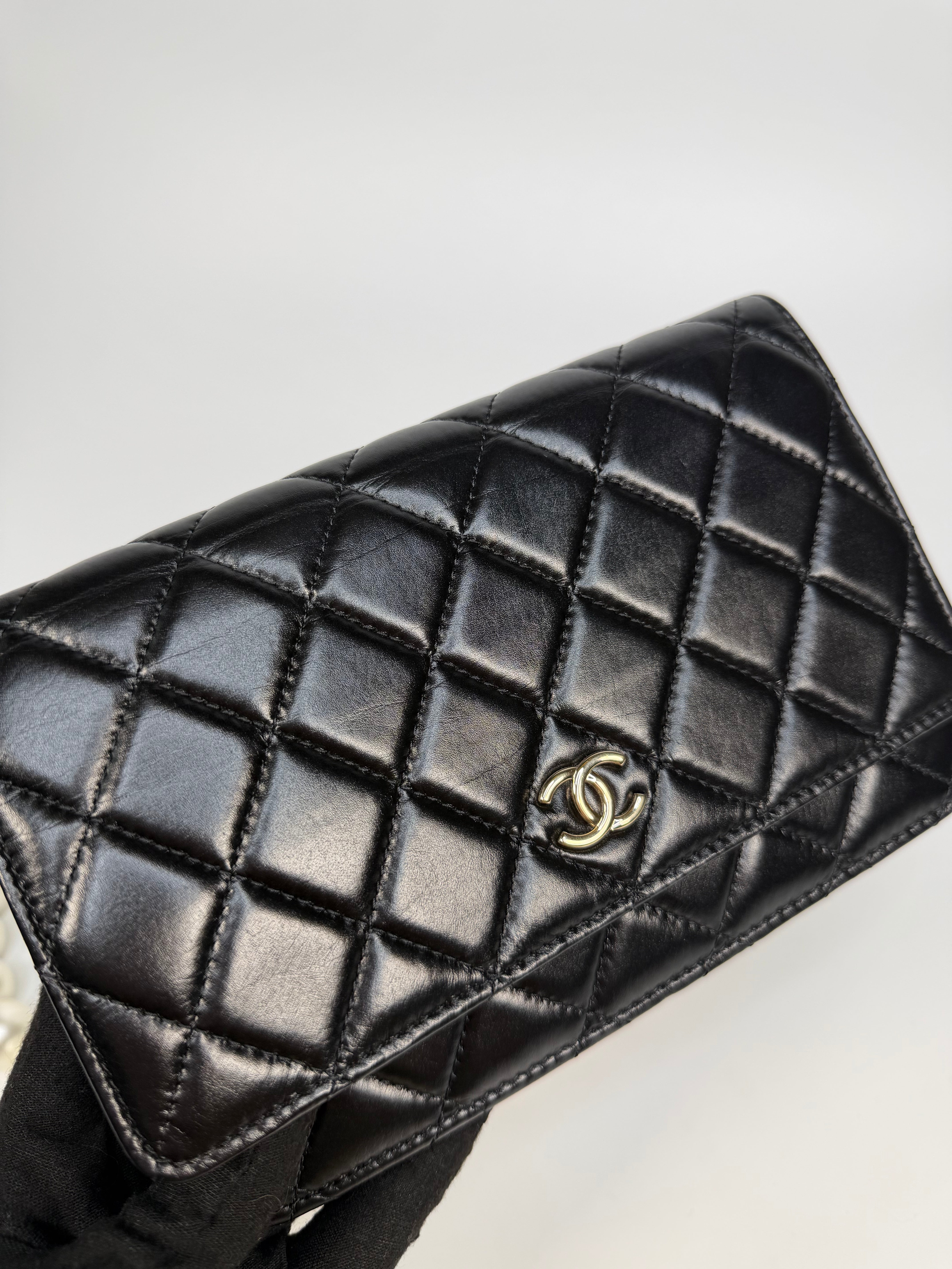 Chanel Pearl Wallet On Chain In Black Lambskin Leather With Gold Hardware. Authentic and preloved in very good condition.